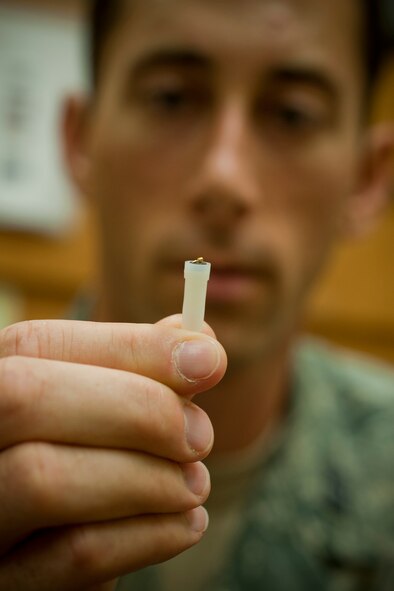 MOODY AIR FORCE BASE, Ga. -- Capt. Trevor Ambron, 822nd Base Defense Squadron physician’s assistant, shows an example of an acupuncture needle at Moody Air Force Base, Ga., Oct. 14. The needle is specially designed for battlefield use and is smaller than most acupuncture needles. (U.S. Air Force photo/Senior Airman Jamal D. Sutter) 

