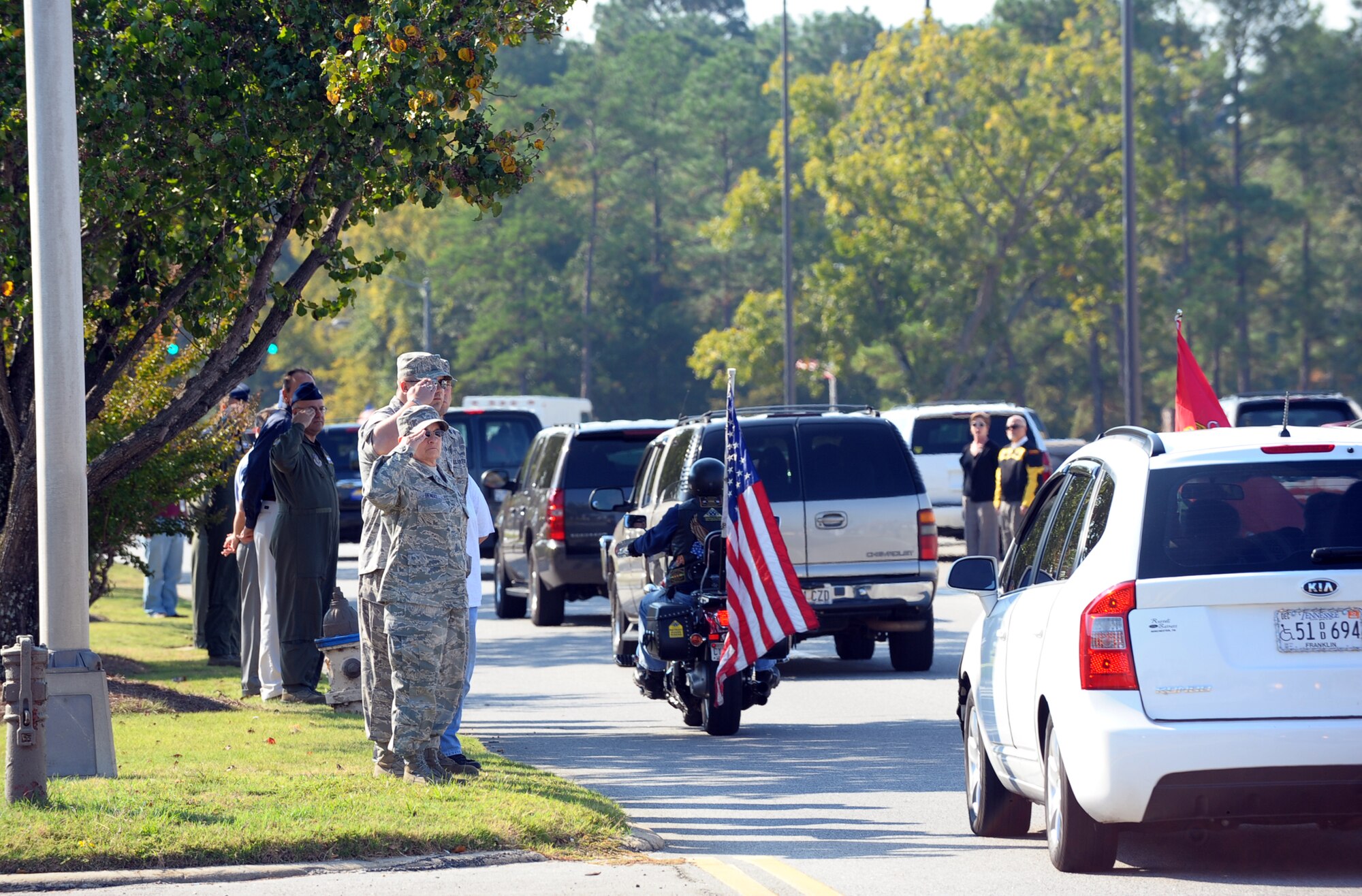 Robins workers pay tribute to Corporal Stephen "Coty" Sockalosky along Robins Parkway. Cpl. Sockalosky was killed in action on Oct. 6 while supporting combat operations in Afghanistan. U. S. Air Force photo by Raymond Crayton, Jr.