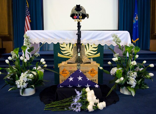 NELLIS AIR FORCE BASE, Nev. – Hundreds of people gathered Oct. 15 at the base chapel for a memorial service for Senior Airman Michael Buras. Senior Airman Buras was an Explosive Ordinance Disposal Journeyman assigned to the 99th Civil Engineers Squadron. Airman Buras was killed in action while deployed to Afghanistan and responding to an Improvised Explosive Device Sept. 21. (U.S. Air Force photo by Senior Airman Brett Clashman) 