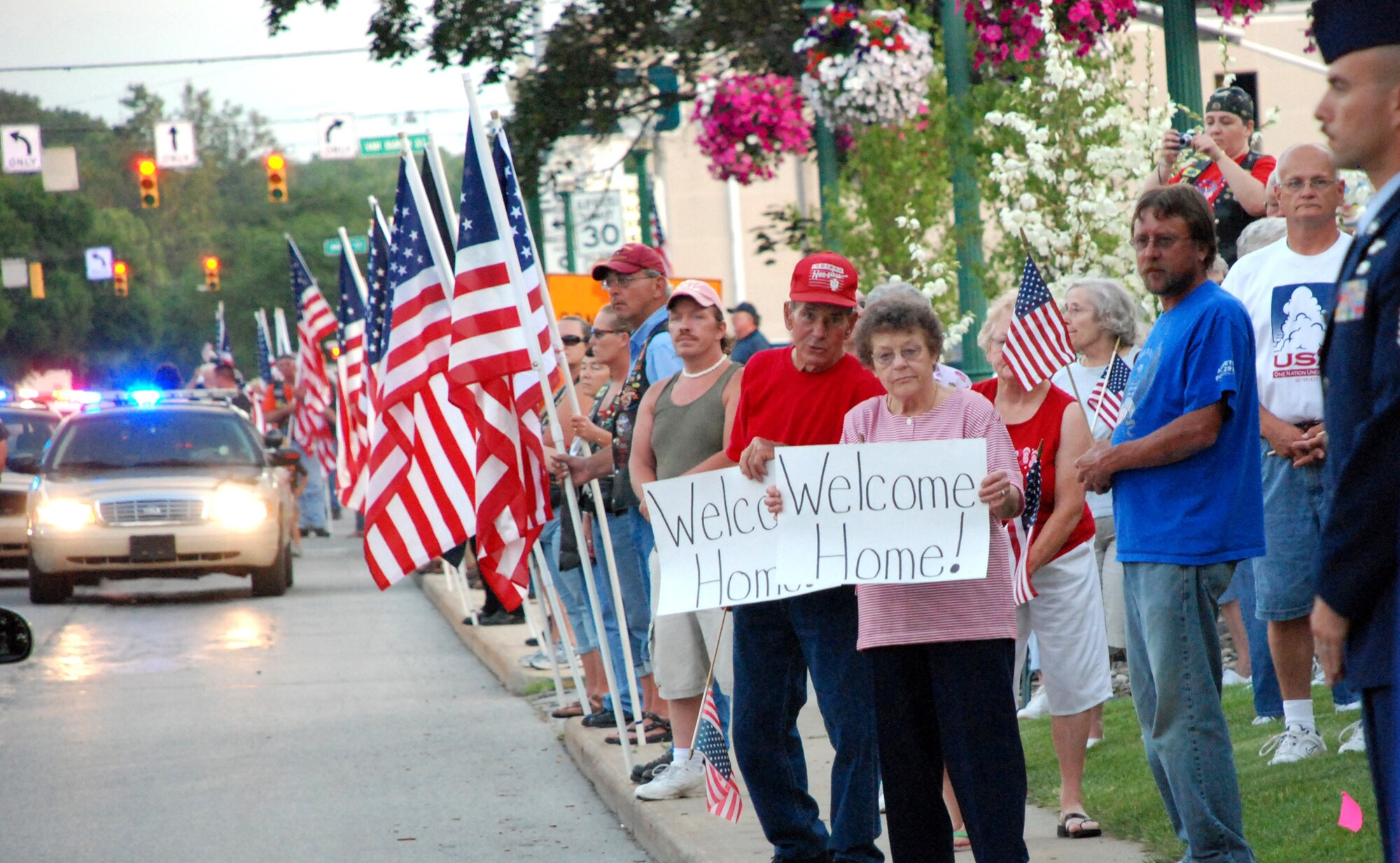 Community members line the streets to pay tribute to Air Force Tech. Sgt. Roy DeWitt Prater June 17, 2010, in Columbia City, Ind. Sergeant Prater's helicopter was shot down in 1972. He was missing in action until Joint POW/MIA Accounting Command officials recovered and later positively identified his remains. (Courtesy photo)