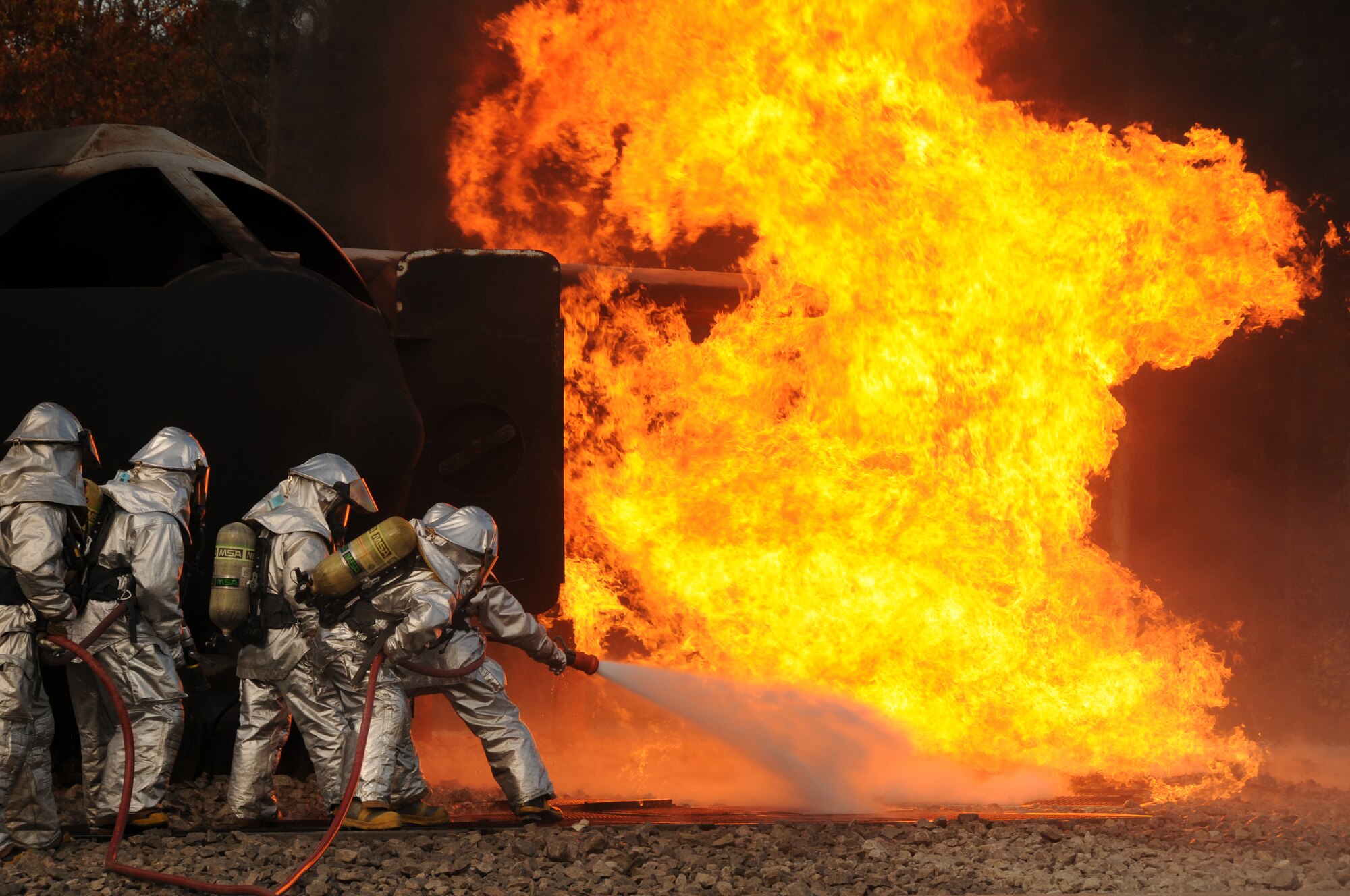 U.S. Air Force firefighters from the 180th Fighter Wing, extinguish an aircraft fire during a training exercise at the Phelps Collins Combat Readiness Training Center, Alpena, Michigan, October 16, 2010.  Firefighters from the 180 FW are doing annual training to prepare them for various rescue situations. (U.S. Air Force photo by Senior Airman Amber Williams/Released)