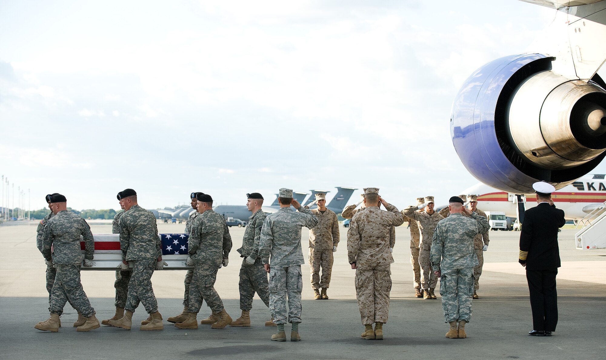 A U.S. Army carry team transfers the remains of Army Spc. Rafael Martinez of Spring Valley, Calif., at Dover Air Force Base, Del., Oct. 15, 2010.  Martinez was assigned to the 7th Squadron, 10th Cavalry Regiment, 1st Brigade Combat Team, 4th Infantry Division, Fort Carson, Colo. (U.S. Air Force photo/Jason Minto)
