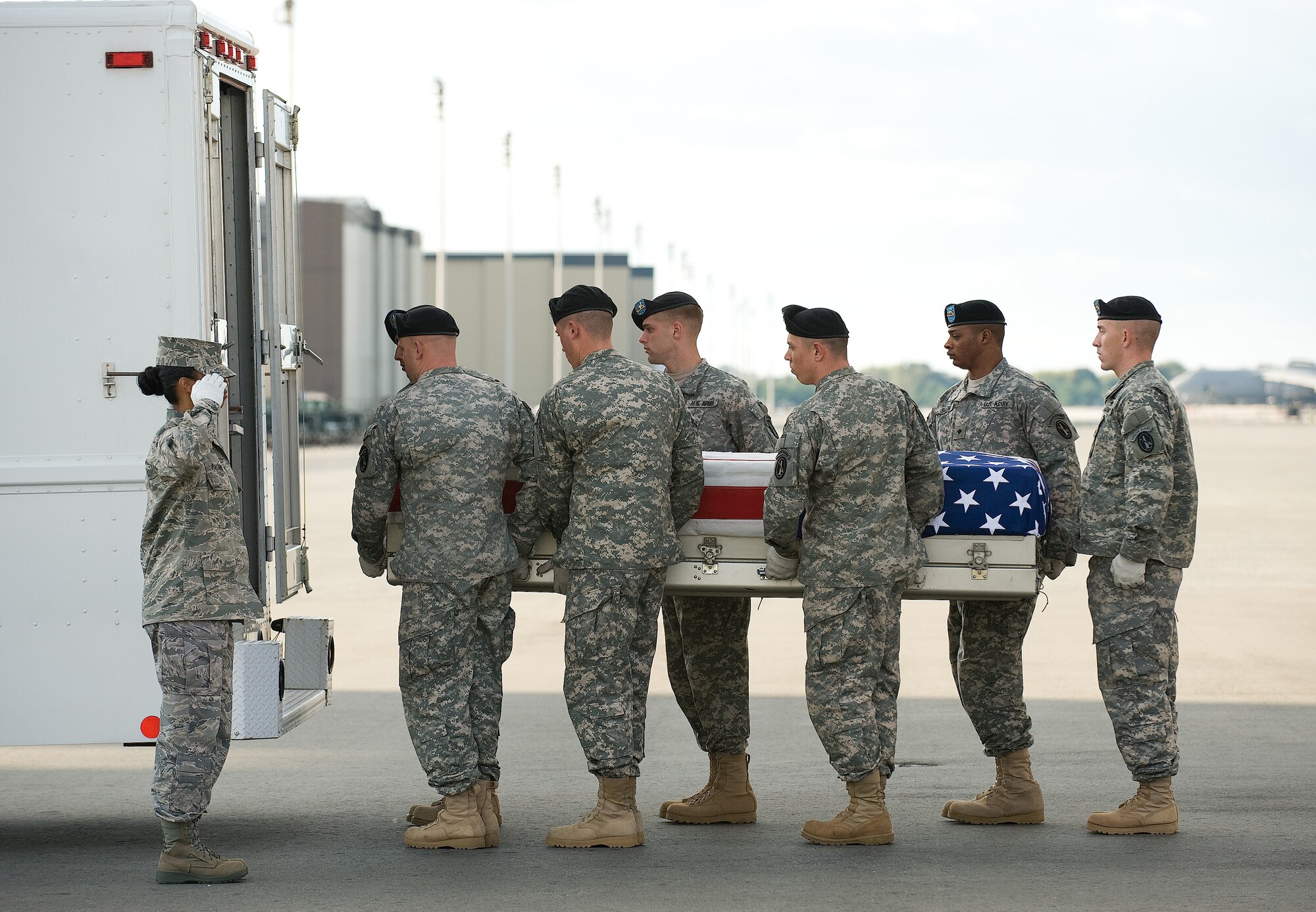 A U.S. Army carry team transfers the remains of Army Sgt. Eric C. Newman of Waynesboro, Miss., at Dover Air Force Base, Del., Oct. 15, 2010.  Newman was assigned to 1st Battalion, 502nd Infantry Regiment, 2nd Brigade Combat Team, 101st Airborne Division (Air Assault), Fort Campbell, Ky. (U.S. Air Force photo/Jason Minto)