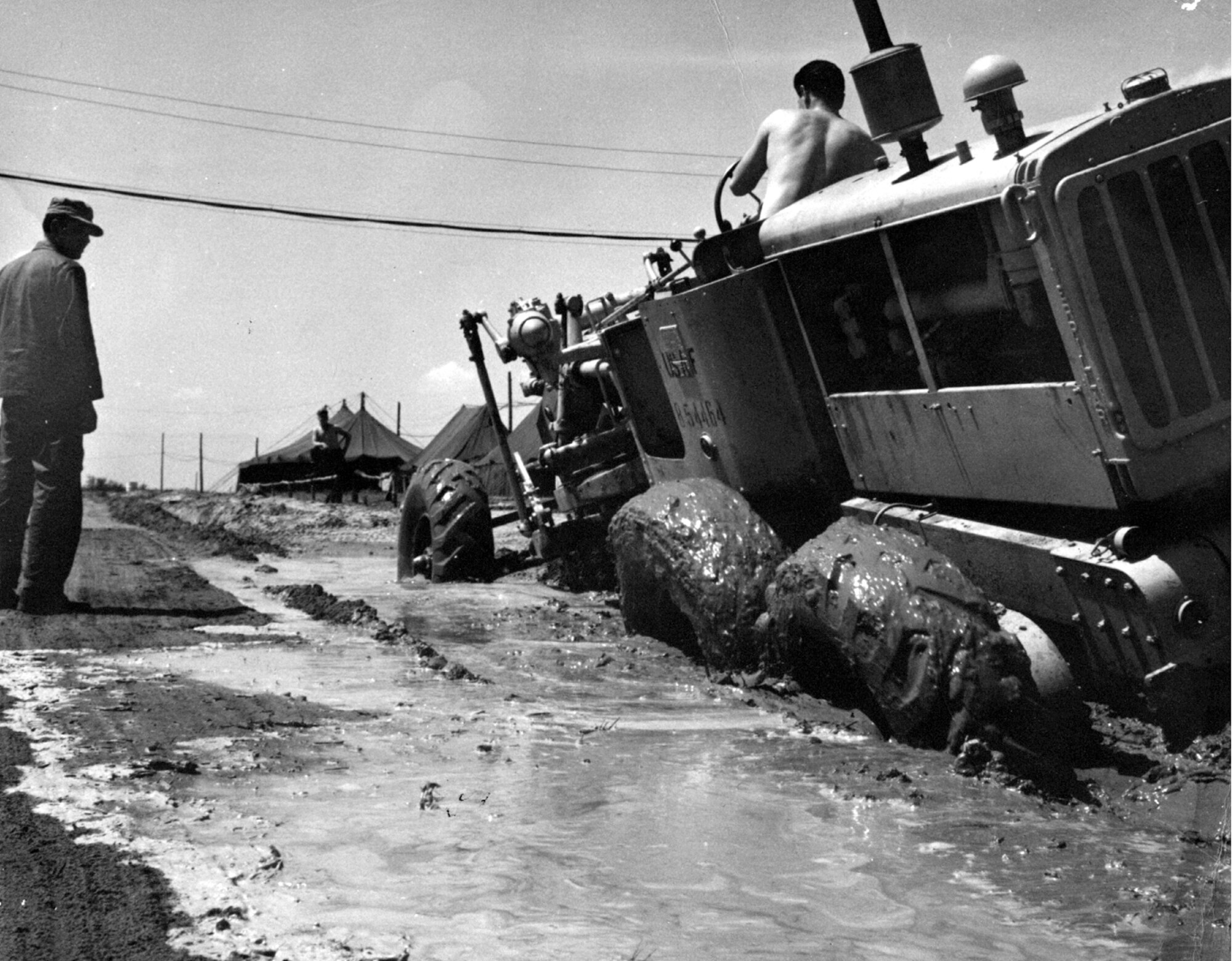 Airmen of the 21st Fighter Bomber Wing work in the mud to set up the Chambley Air Base at the former Chambley-Bussieres airfield in France. Construction began in 1952 and the 21 FBW officially established its headquarters at Chambley on Dec. 12, 1954. Airmen affectionately referred to the base as “Mudbley.” (Courtesy photo/Bob Sisk)