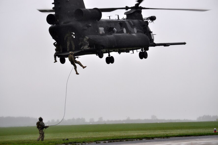 SWIDWIN, Poland -- Members of the 321st Special Tactics Squadron, RAF Mildenhall, U.K., fast rope out of a 160th Special Operations Aviation  Regiment, Fort Campbell, Ky.,  MH-47 Chinook helicopter during Exercise JACKAL STONE 10 activities here.  JACKAL STONE 10 is the biggest international special operations forces exercise hosted by Poland and Lithuania this year.  (U.S. Air Force photo by Tech. Sgt. Marelise Wood)