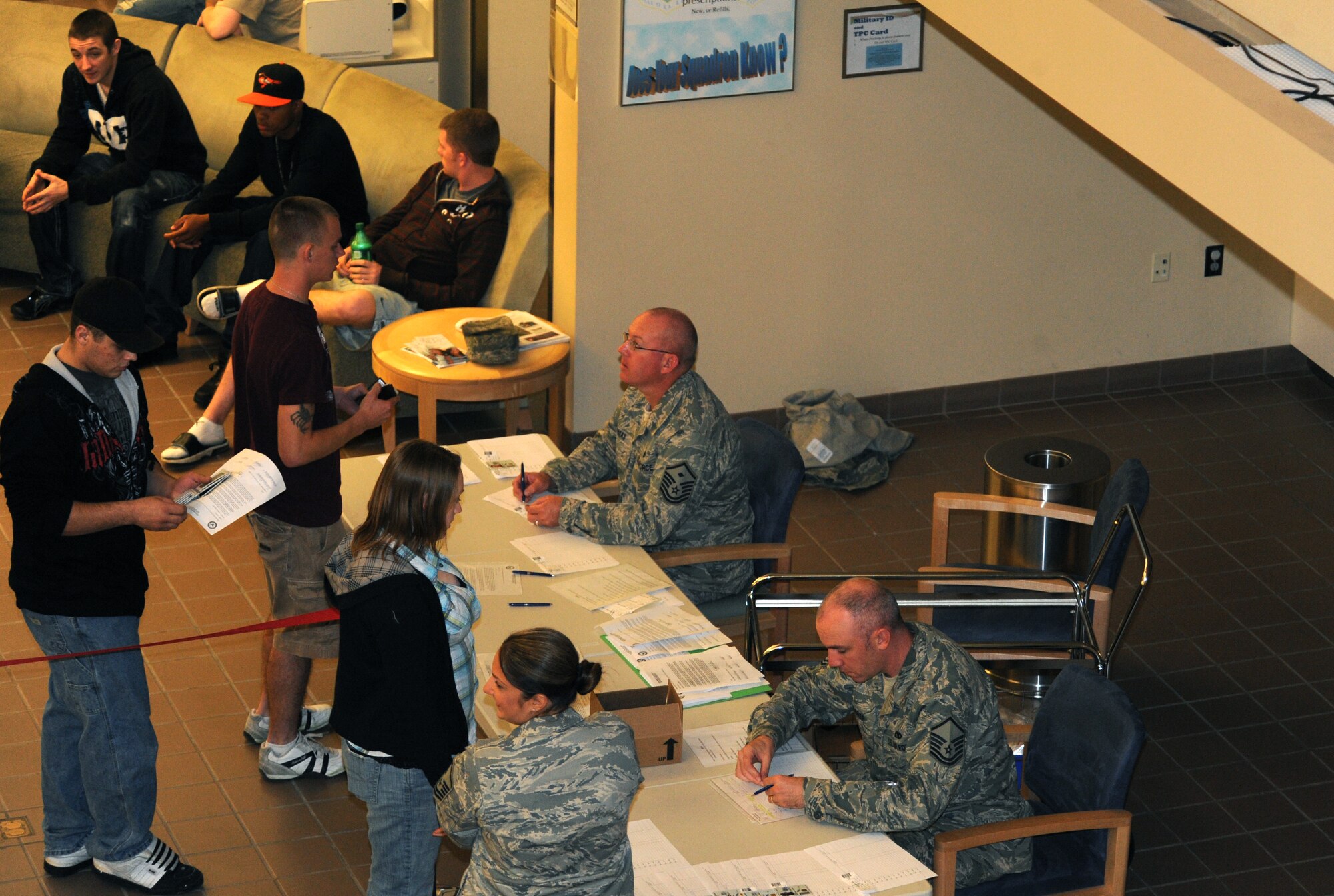 MINOT AIR FORCE BASE, N.D. -- Master Sgt. Richard Thomas, 17th Munitions Squadron first sergeant, and Master Sgt. Aaron Shearer, 5th Aircraft Maintenance Squadron assistant first sergeant, verify information with Airmen during Operation Prairie Hawk here Oct. 10. First sergeants from both the 5th Bomb Wing and the 91st Missile Wing in partnership with the Drug Demand Reduction Office, Air Force Office of Special Investigations and Judge Advocate General office conducted the sweep to present a clear deterrent to drug use. The ordered sweep is crucial to ensuring Airmen are fit for duty and key to meeting uncompromising adherence to all directives. (U.S. Air Force photo by Tech. Sgt. Lee A. Osberry Jr.)