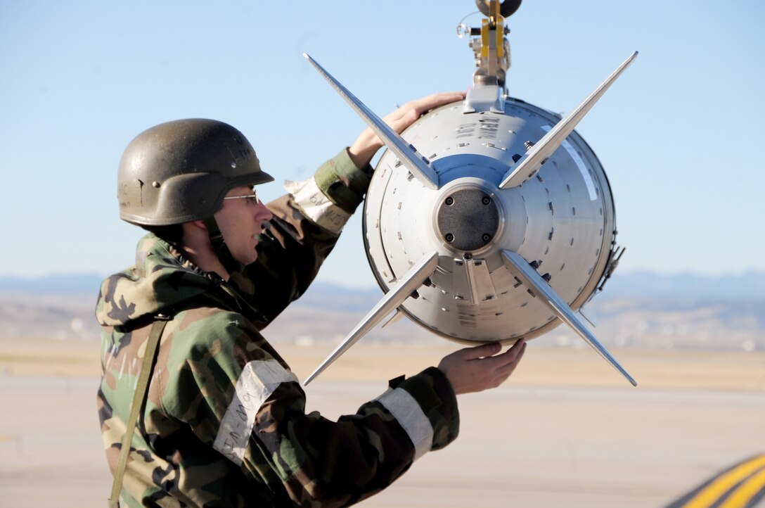 Airman 1st Class Timothy Foreman makes sure a guided bomb unit-31 is on a bomb lift securely during a Phase II Operational Readiness Inspection Oct. 15, 2010, at Ellsworth Air Force Base, S.D.   Airman Foreman is a munitions load crew member of the 28th Munitions Squadron. (U.S. Air Force photo/Airman 1st Class Anthony Sanchelli)
