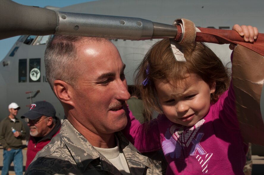 Family Day at the 133rd Airlift Wing kicked off with a ceremony for Major General Larry W. Shellito, the Adjutant General of Minnesota.  Gen. Shellito, soon to be retiring, was presented a framed photo by the 133rd Airlift Wing Commander Colonel Greg A. Hasse. Events for children and family members included a fish pond, shooting gallery, climbing wall, hay ride, bean bag toss, hammer bell, bouncing room, and basket ball toss. Static displays and demonstrations on the flightline included a F-16 ?Fighting Falcon? and one of the Wing?s C-130 ?Hercules? cargo aircraft. A K-9 demonstration by members of the St. Paul Police Department was well attended. Food was provided free of charge and served by Fat Lorenzos of Minneapolis to the Airmen and their families. Air Force by Tech. Sgt. Erik Gudmundson (released)