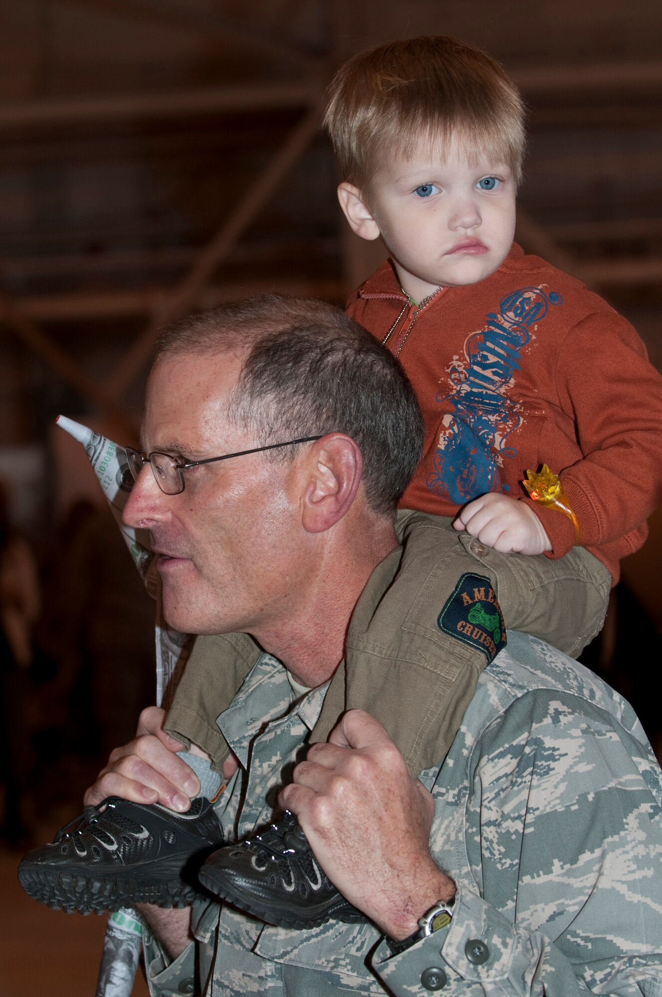 Family Day at the 133rd Airlift Wing kicked off with a ceremony for Major General Larry W. Shellito, the Adjutant General of Minnesota.  Gen. Shellito, soon to be retiring, was presented a framed photo by the 133rd Airlift Wing Commander Colonel Greg A. Hasse. Events for children and family members included a fish pond, shooting gallery, climbing wall, hay ride, bean bag toss, hammer bell, bouncing room, and basket ball toss. Static displays and demonstrations on the flightline included a F-16 ?Fighting Falcon? and one of the Wing?s C-130 ?Hercules? cargo aircraft. A K-9 demonstration by members of the St. Paul Police Department was well attended. Food was provided free of charge and served by Fat Lorenzos of Minneapolis to the Airmen and their families. Air Force by Tech. Sgt. Erik Gudmundson (released)