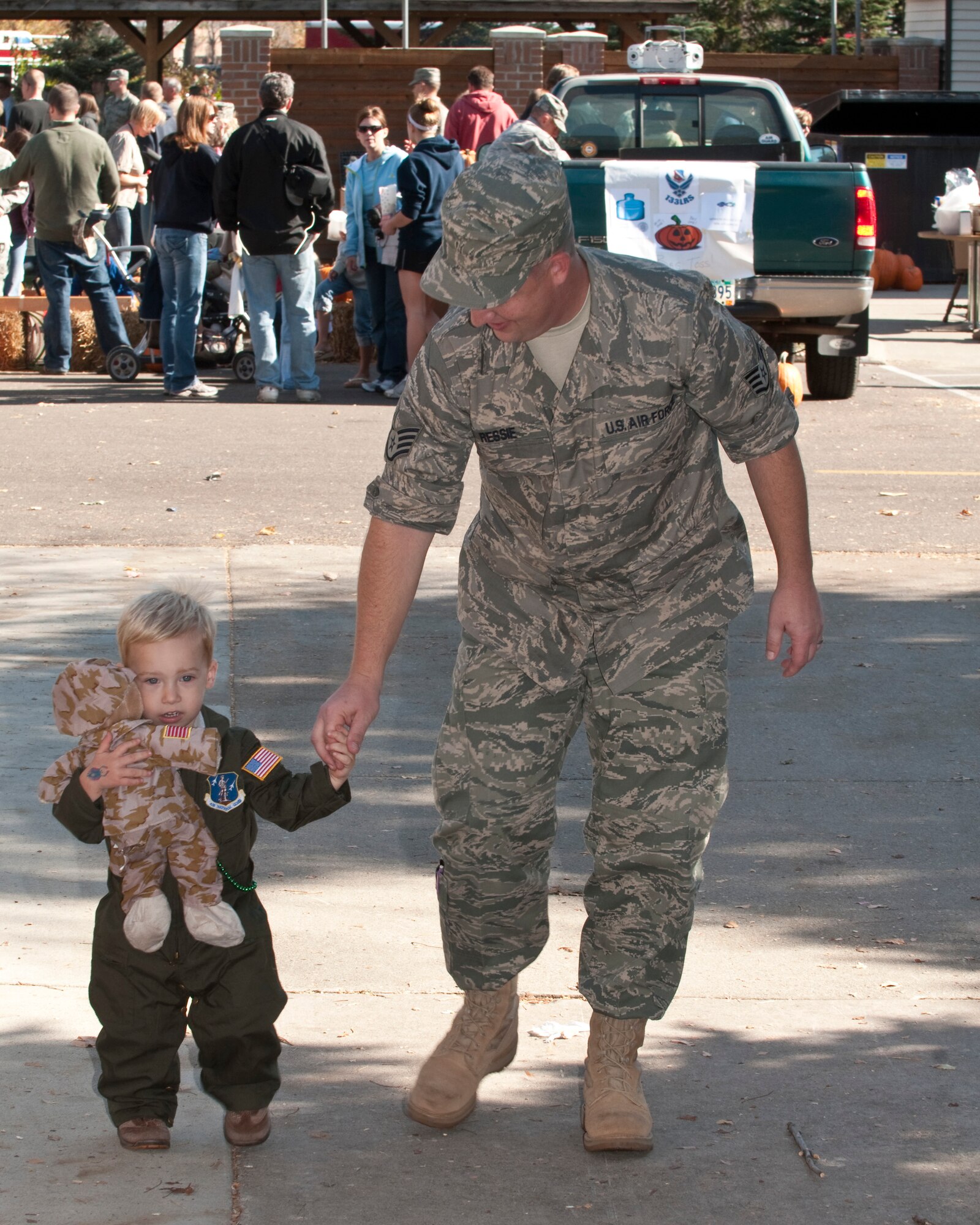 Family Day at the 133rd Airlift Wing kicked off with a ceremony for Major General Larry W. Shellito, the Adjutant General of Minnesota.  Gen. Shellito, soon to be retiring, was presented a framed photo by the 133rd Airlift Wing Commander Colonel Greg A. Hasse. Events for children and family members included a fish pond, shooting gallery, climbing wall, hay ride, bean bag toss, hammer bell, bouncing room, and basket ball toss. Static displays and demonstrations on the flightline included a F-16 ?Fighting Falcon? and one of the Wing?s C-130 ?Hercules? cargo aircraft. A K-9 demonstration by members of the St. Paul Police Department was well attended. Food was provided free of charge and served by Fat Lorenzos of Minneapolis to the Airmen and their families. Air Force by Tech. Sgt. Erik Gudmundson (released)