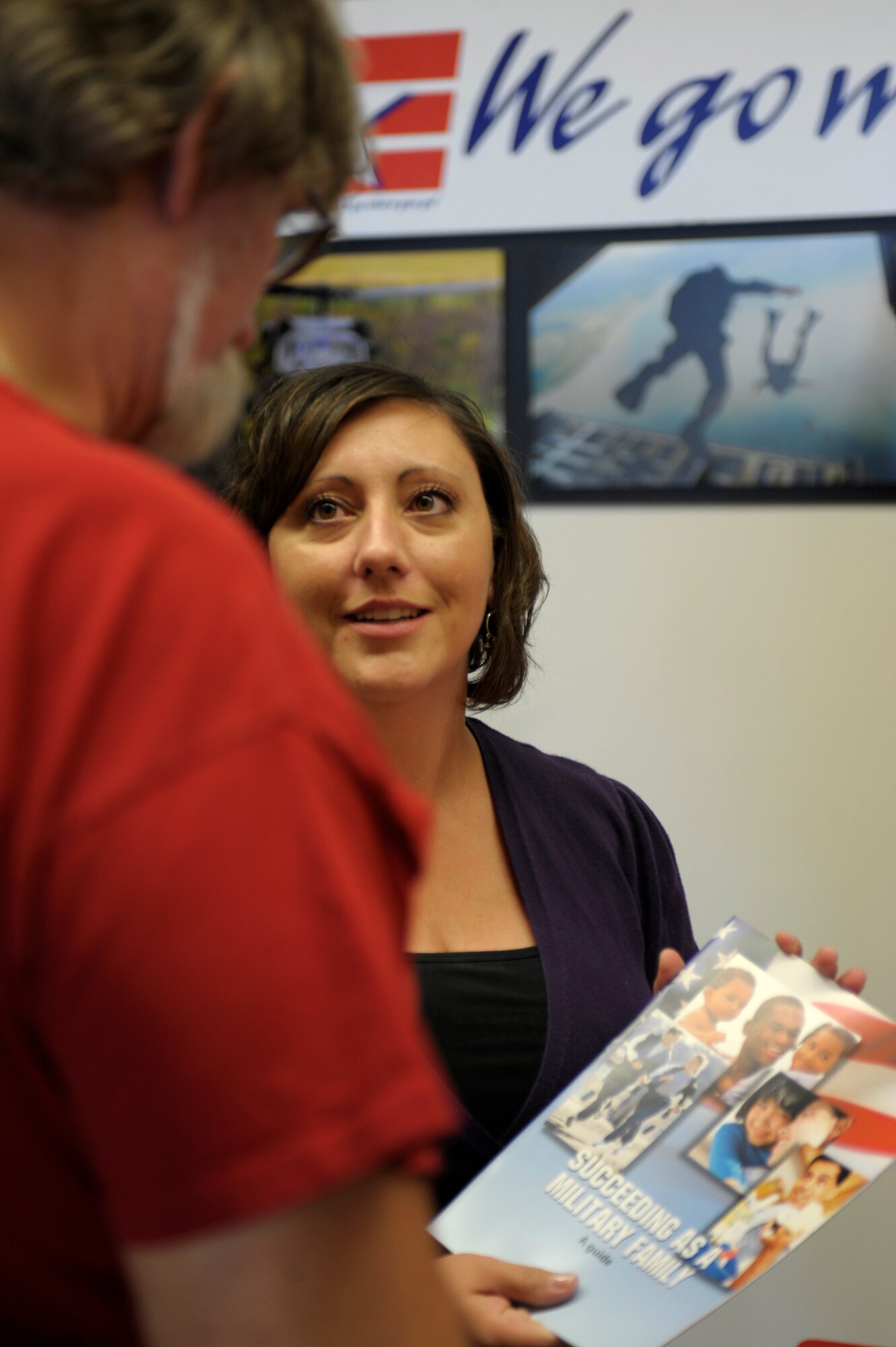Tyleen Caffrey, Family Advocacy Programs outreach manager, speaks about domestic abuse at the base exchange, Oct. 15. October is Domestic Violence Awareness Month and a concerted effort is made nationwide to support domestic violence programs' awareness and education efforts. (U.S. Air Force photo by Airman Ericka Engblom)