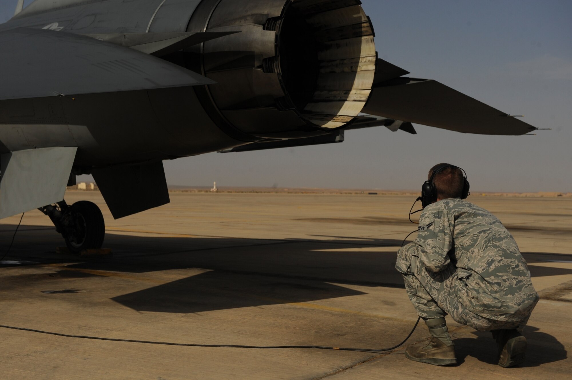 U.S. Air Force Airman 1st Class Zach Goodwin, a native of Nashville Tenn., conducts pre-flight checks on an  F-16 Fighting Falcon as it prepares for takeoff as part of The Falcon Air Meet 2010 at Azraq Air Base, Jordan, Oct. 18, 2010.  Airman Goodwin is assigned to the 77th Aircraft Maintenance Unit from Shaw Air Force Base, S.C.  (U.S. Air Force Photo/Staff Sgt. Eric Harris) (RELEASED)
