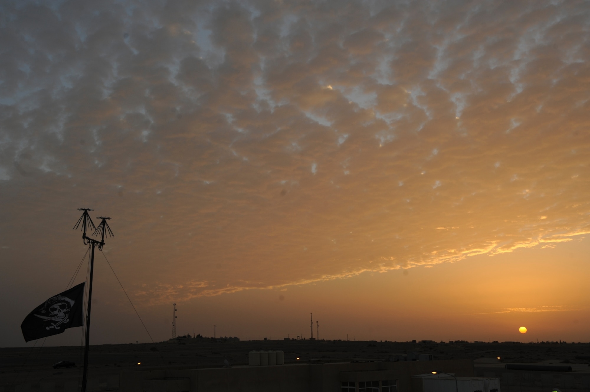 The sun rises over Azraq Air Base, Jordan as U.S. Air Force Airmen prepare for The Falcon Air Meet 2010, Oct. 18, 2010.  The purpose of The Falcon Air Meet is to improve international military relations and joint air operations.  (U.S. Air Force Photo/Staff Sgt. Eric Harris) (RELEASED)