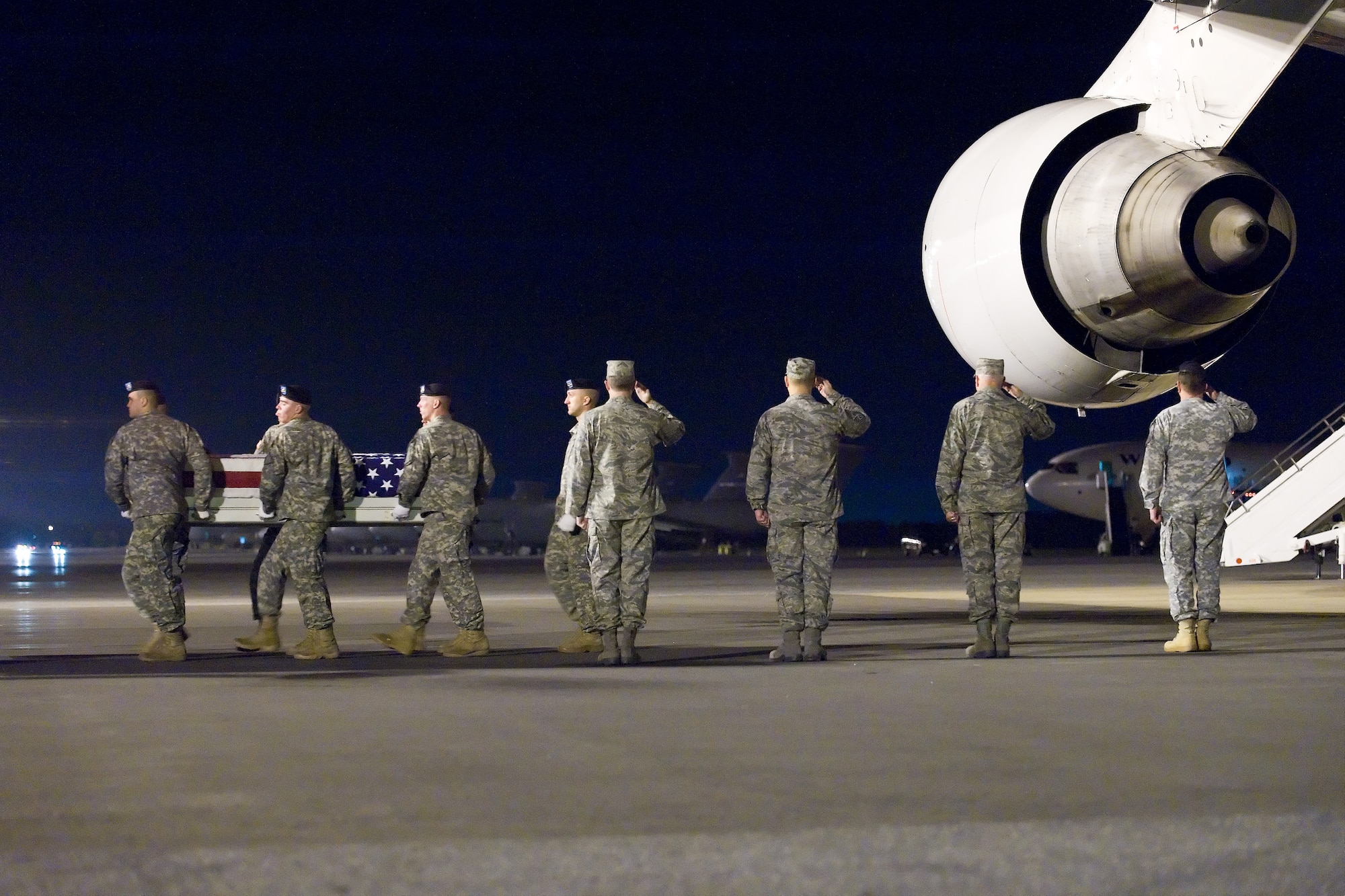 A U.S. Army carry team transfers the remains of Army Pfc. Ryane G. Clark, of New London, Minn., at Dover Air Force Base, Del., Oct. 7, 2010. Clark was assigned to the 27th Combat Engineer Battalion (Airborne), 20th Combat Engineer Brigade, Fort Bragg, N.C. (U.S. Air Force photo/Roland Balik)