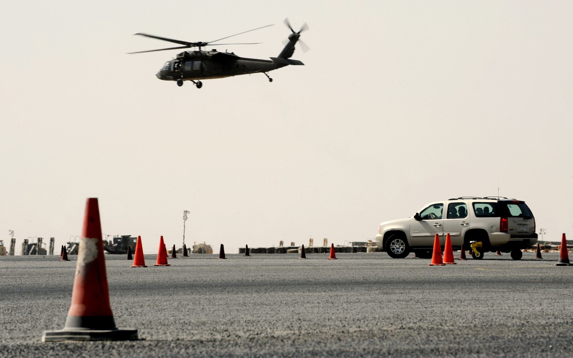 SOUTHWEST ASIA -- A helicopter flies overhead Oct. 12 during an Army Safe Driver Training course. Safe driving techniques are taught using a course on a restricted part of the flightline at an undisclosed location here. The ASDT has trained more than 15,500 U.S. and host-nation military members on various driving techniques since opening in late 2005. (U.S. Air Force photo by Senior Airman Laura Turner)