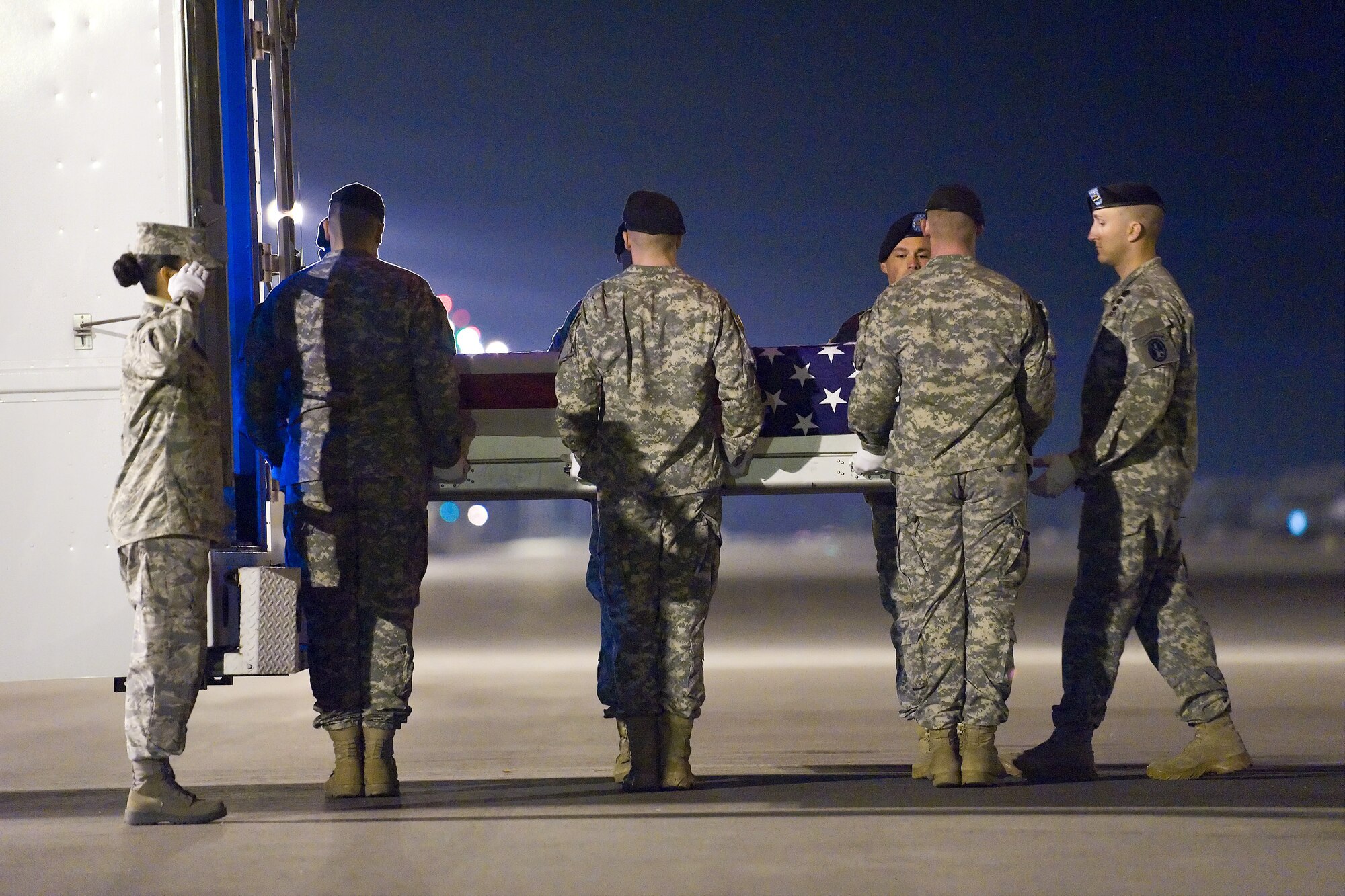 A U.S. Army carry team transfers the remains of Army Spc. Joseph T. Prentler, of Fenwick, Mich., at Dover Air Force Base, Del., Oct. 7, 2010. Prentler was assigned to the 3rd Squadron, 2nd Stryker Cavalry Regiment, Vilseck, Germany. (U.S. Air Force photo/Roland Balik)