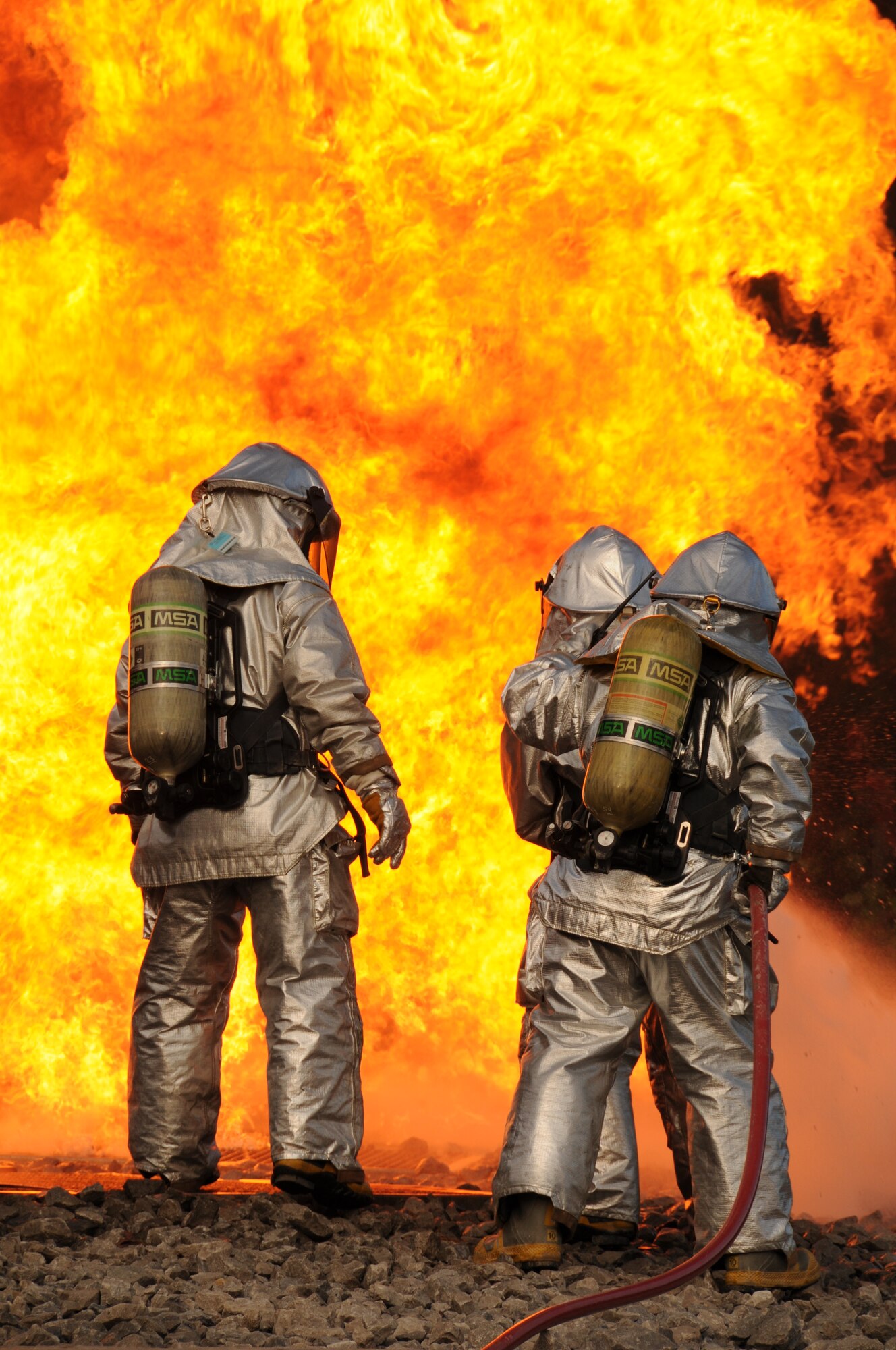U.S. Air Force firefighters from the 180th Fighter Wing, extinguish an aircraft fire during a training exercise at the Phelps Collins Combat Readiness Training Center, Alpena, Michigan, October 16, 2010.  Firefighters from the 180 FW are doing annual training to prepare them for various rescue situations. (U.S. Air Force photo by Senior Airman Amber Williams/Released)