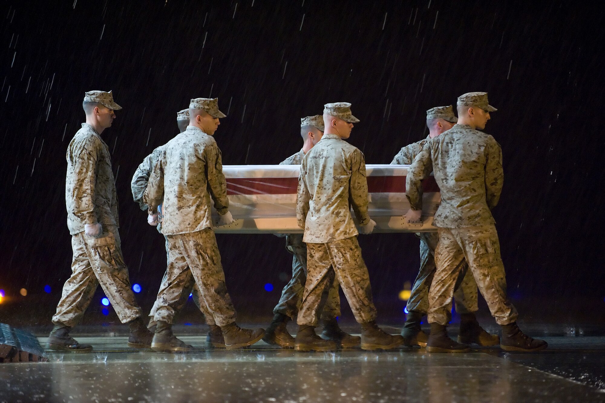 A U.S. Marine Corps team transfers the remains of Marine Corps Lance Cpl. Ralph J. Fabbri, of Gallitzin, Pa., at Dover Air Force Base, Del., Sept. 30, 2010. Fabbri was assigned to the Headquarters Battalion, 1st Marine Division, I Marine Expeditionary Force, Camp Pendleton, Calif.  (U.S. Air Force photo/Roland Balik)