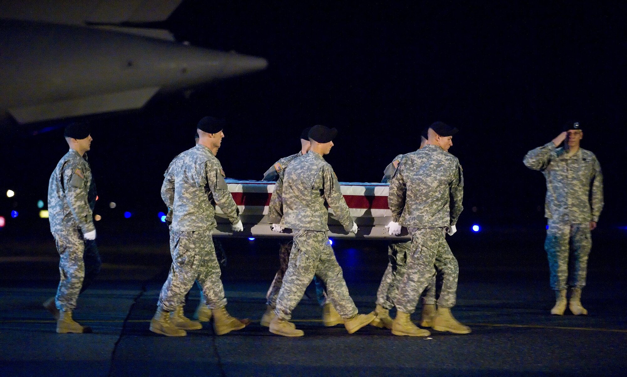 A U.S. Army carry team transfers the remains of Army Pfc. Jaysine Petree of Yigo, Philippines at Dover Air Force Base, Del., Sept. 26, 2010.  Petree was assigned to 17th Combat Sustainment Support Battalion, 3rd Maneuver Enhancement Brigade, Fort Richardson, Alaska. (U.S. Air Force photo/Jason Minto)