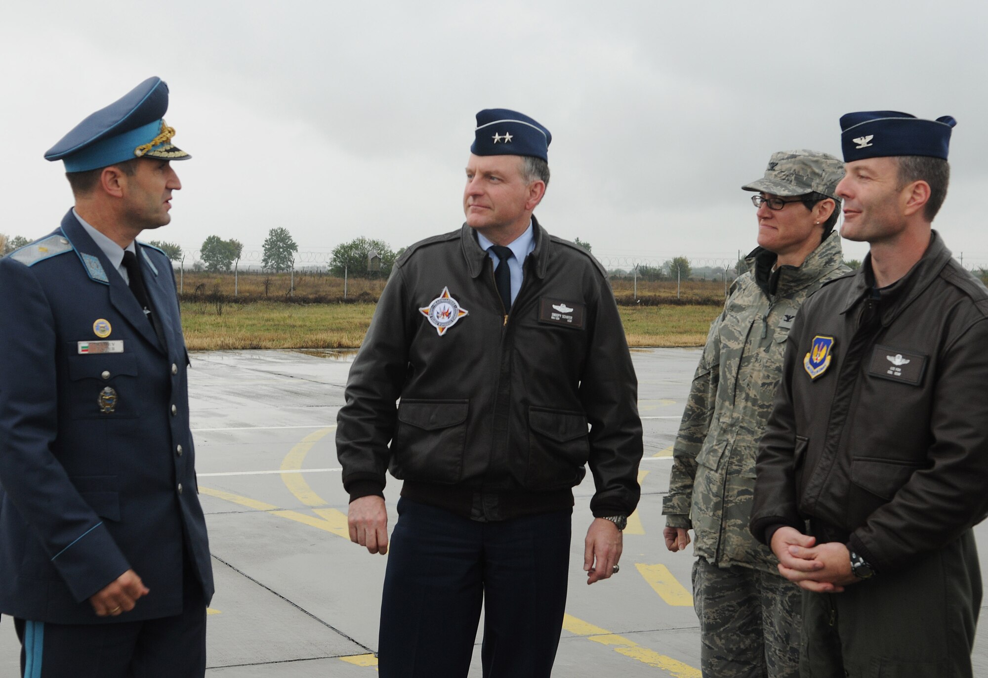 GRAF IGNATIEVO AIR FORCE BASE, Bulgaria - Brig. Gen. Rumen Radev, left, Bulgarian air force deputy commander; Col. Jackson Fox, far right, 52nd Operations Group commander; and Col. Jodine Tooke, right, 52nd Mission Support Group commander, greet Maj. Gen. Paul G. Schafer, U.S. European Command plans and policy director, as he arrives at Graf Ignatievo Air Force Base during Operation Thracian Star Oct. 14. The operation was a three-week, combined exercise that gave the U.S. and Bulgarian Air Forces the opportunity to share ideas and train together. (U.S. Air Force photo/Staff Sgt. Benjamin Wilson)