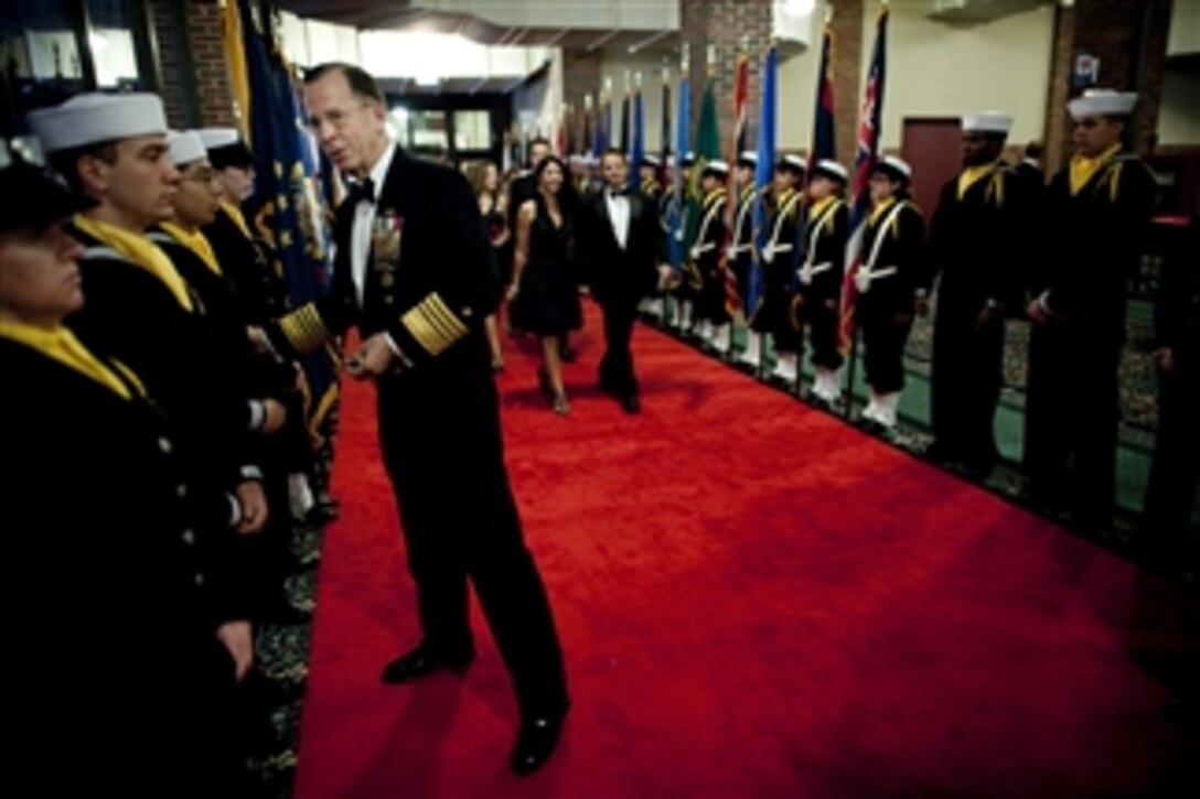 Chairman of the Joint Chiefs of Staff Adm. Mike Mullen, U.S. Navy, greets recruits assigned to Recruit Training Command at the USO of Illinois Star Spangled Salute in Chicago on Oct. 17, 2010.  
