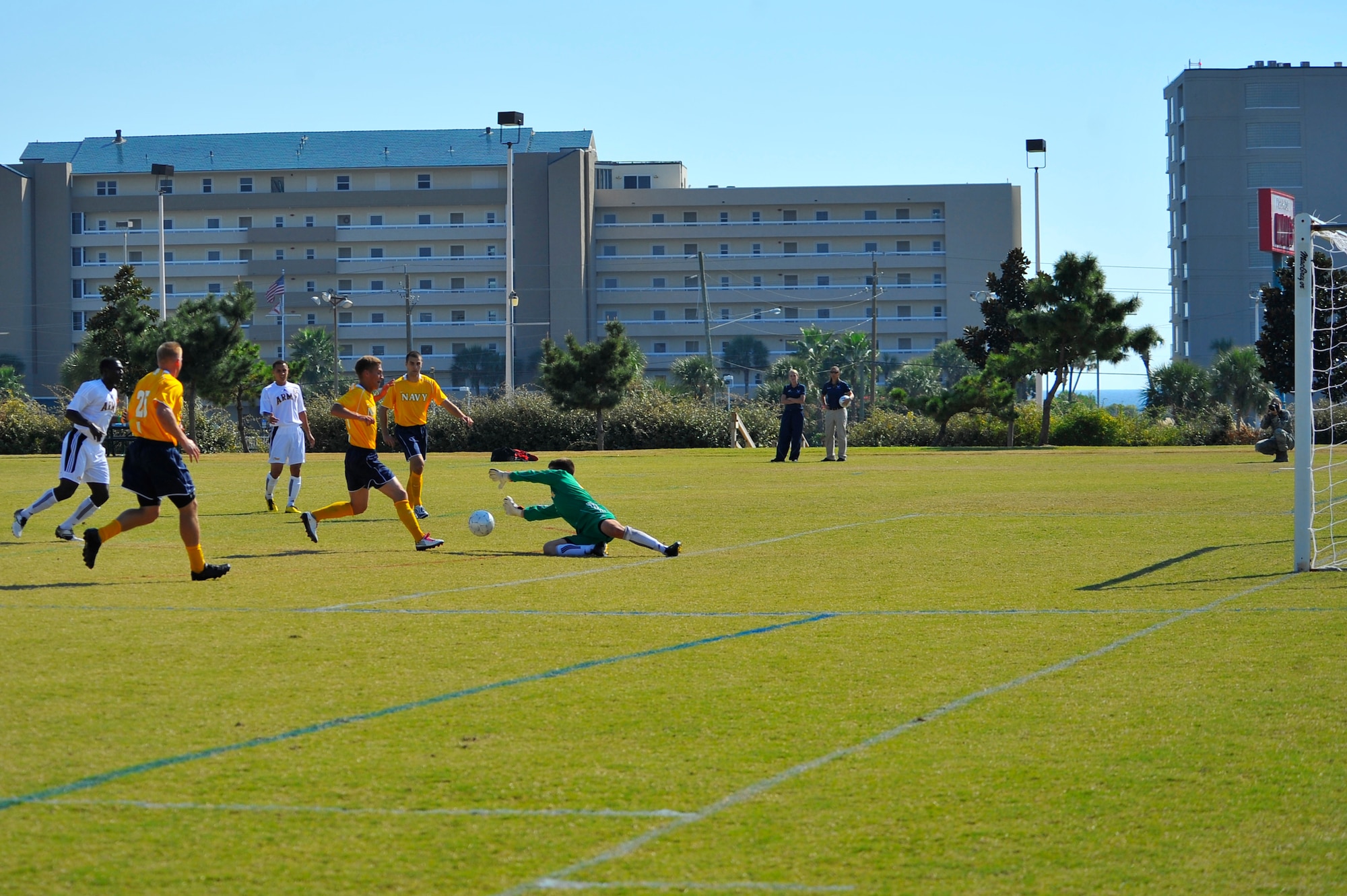 U.S. Army 2nd Lt. Andrew Glubzinski, assigned to Hohenfels, Germany, a goalie for the USA soccer team, blocks a goal attempt by U. S. Navy Aviation Electrician's Mate Airman Apprentice Austin Meier, assigned to Carrier Airborne Early Warning Squadron One One Two, Point Mugu, Calif., during an Armed Forces Men's Soccer Championship Round Robin match at Morgan Sports Complex, Destin, Fla., Oct. 18, 2010. The Armed Forces Championships are conducted by the Armed Forces Sports Council for the purpose of promoting, understanding, goodwill, and competition among the Armed Services. (DoD photo by U.S. Air Force Senior Airman Sheila deVera/RELEASED)
