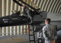 Capt. Jason Oates, 18th Agressor Squadron, prepares to fly his F-16 fighter jet  Oct. 18, at Osan Air Base, Republic of Korea.  The 18th Agressor Squadron, deployed from Eielson Air Force Base, Alaska, will participate in the fourth annual MAX THUNDER exercise hosted by Kwanju Air Base, Republic of Korea.  The exercise will include side-by-side mission planning and practice of air operation scenarios. (U.S. Air Force Photo/Senior Airman Evelyn Chavez)