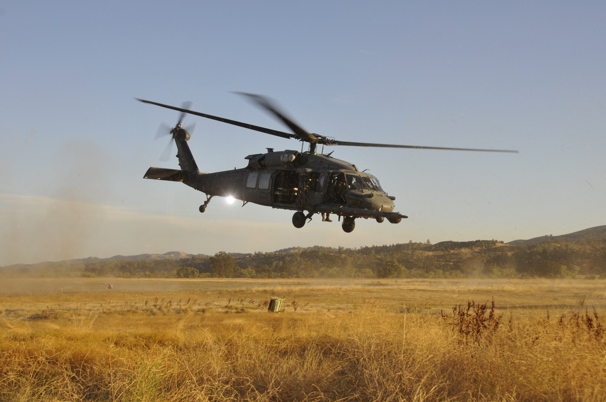 129th Rescue Squadron operators take off in an HH-60G Pave Hawk rescue helicopter in response to a search and rescue scenario during exercise Soaring Angel 10-2 Oct. 1, 2010 at Fort Hunter Liggett, Calif. Soaring Angel is the 129th Rescue Wing's tactical training exercise that prepares Airmen for an upcoming Operational Readiness Inspection. (Air National Guard photo by Master Sgt. Dan Kacir)