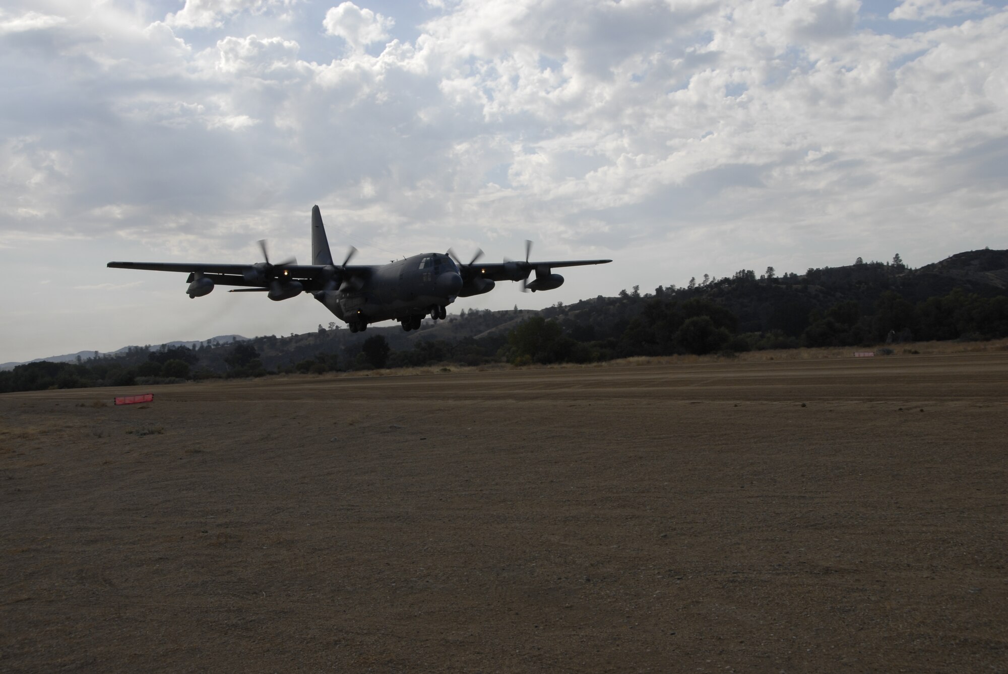 130th Rescue Squadron crews land a C-130P Combat Shadow aircraft at Fort Hunter Liggett, Calif. Oct. 2, 2010 during exercise Soaring Angel 10-2. The aircraft transported additional support personnel from Moffett Federal Airfield, Calif. to participate in the exercise. Soaring Angel is the 129th Rescue Wing's tactical training exercise that prepares Airmen for an upcoming Operational Readiness Inspection. (Air National Guard photo by Airman 1st Class Jessica Green)