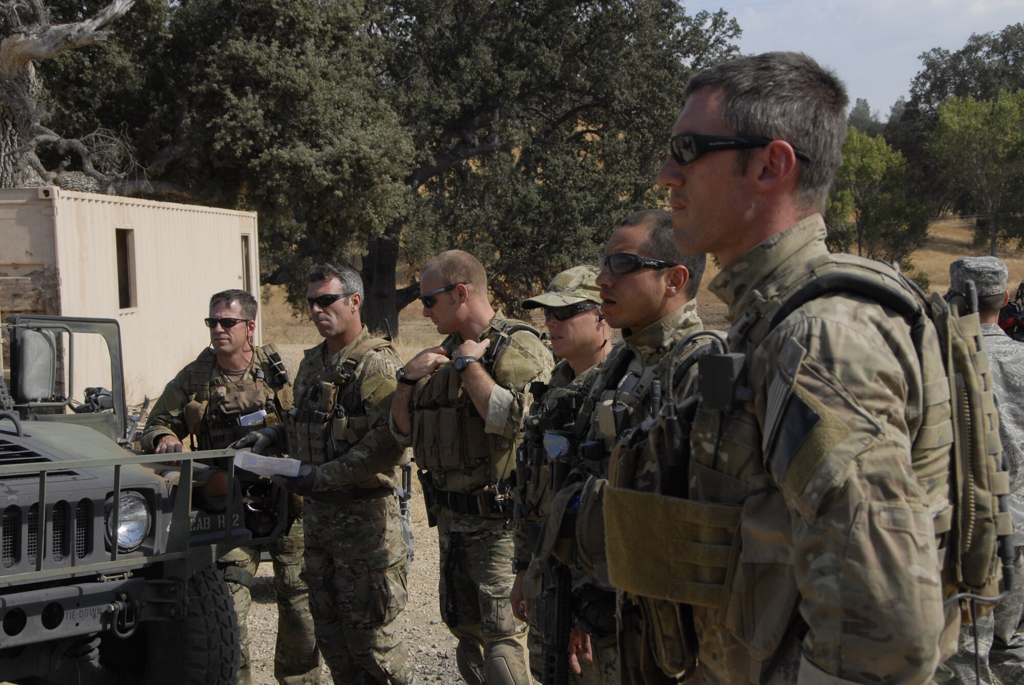 Pararescuemen from the 131st Rescue Squadron gather at an urban assault course during exercise Soaring Angel 10-2 Oct. 1, 2010 at Fort Hunter Liggett, Calif. Soaring Angel is the 129th Rescue Wing's tactical training exercise that prepares Airmen for an upcoming Operational Readiness Inspection. (Air National Guard photo by Airman 1st Class Jessica Green)