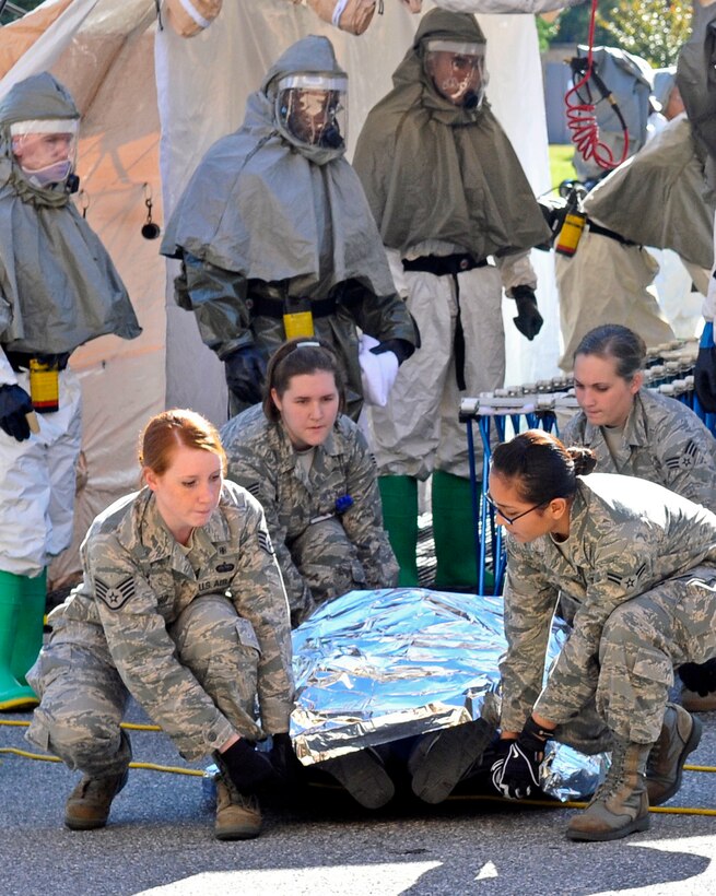 ANDREWS AIR FORCE BASE, Md. -- The manpower team, from the 79th Medical Wing, prepares to move a patient into the hospital after they have been taken through the decon line during the Capital Shield 11 Exercise Oct. 13 here.  (U.S. Air Force photo/Melanie Moore)