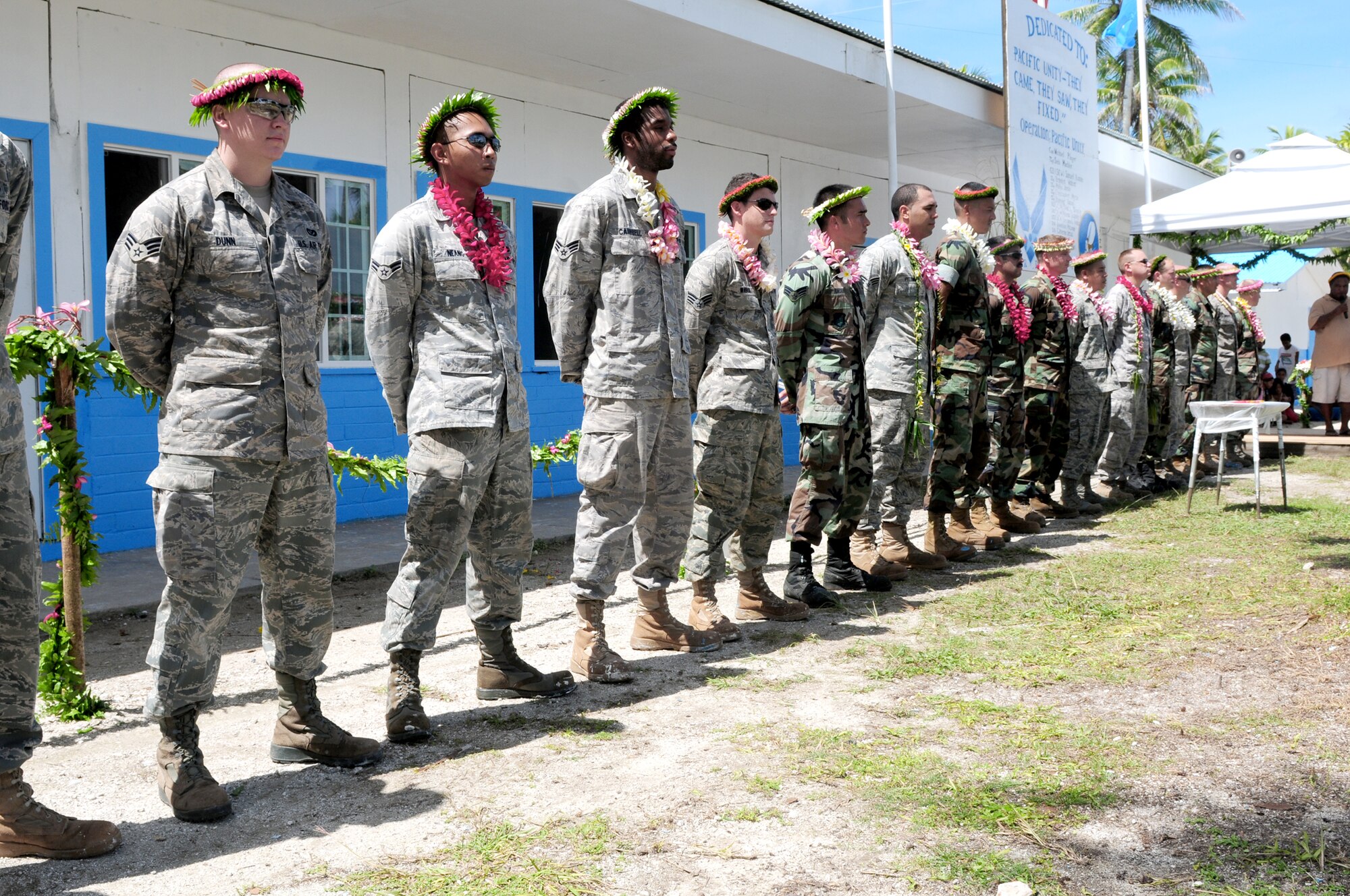 Members of the Pacific Unity engineering team, made up of U.S. Air Force engineers from Yokota, Japan, and U.S. Navy Seabees from San Diego, Calif., are recognized during a dedication ceremony Sept. 22, 2010, in Yap, Federated States of Micronesia. Pacific Unity is a humanitarian civil engineering effort in which 18 engineers completely rebuilt, remodeled and repainted a high school on a remote island in Micronesia. (U.S. Air Force photo/Master Sgt. Victoria Meyer)