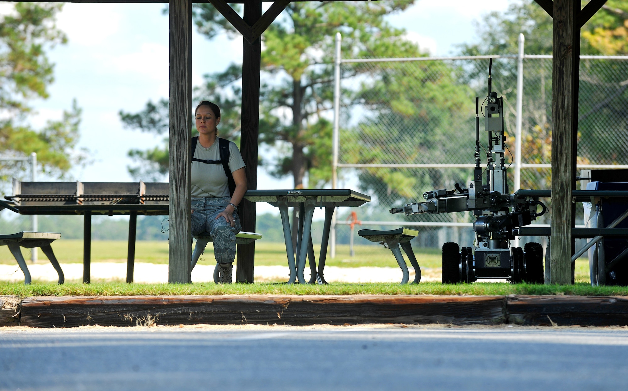 Staff Sgt. Rhianna Hall waits for an F6-A explosive ordnance disposal robot to assist her during a training exercise Oct. 13, 2010, at Moody Air Force Base, Ga. Technicians from the 23rd Civil Engineer Explosive Ordnance Disposal Flight tested out their new Bomb Squad Emergency Response Vehicle during the exercise to test its ability to respond in emergency situations. Sergeant Hall is the combat arms training and maintenance range instructor assigned to the 23rd Security Forces Squadron. (U.S. Air Force photo/Airman 1st Class Joshua Green)