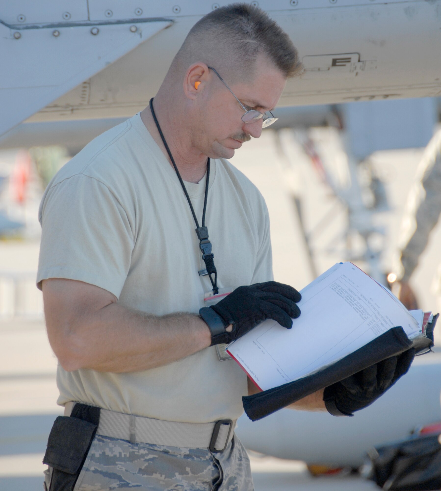 Tech. Sgt. Pete Melby checks the maintenance log on an A-10 Thunderbolt II during Hawgsmoke 2010 at Gowen Air National Guard Base near Boise, Idaho, Oct. 14.  Sergeant Melby is an Air Force Reserve A-10 crew chief assigned to the 442nd Maintenance Group, part of the 442nd Fighter Wing based at Whiteman Air Force Base, Mo.  Hawgsmoke is a bienial competition among the U.S. Air Force's A-10 squadrons that tests pilots' bombing, gunnery, navigation and aviation skills.  The 2010 competition was hosted by the 124th Fighter Wing, Idaho Air National Guard, at Gowen Air National Guard Base, Idaho.  The 124th FW's 190th Fighter Squadron won the competition just as it did in 2008.  (U.S. Air Force photo/Lt. Col. David Kurle)  