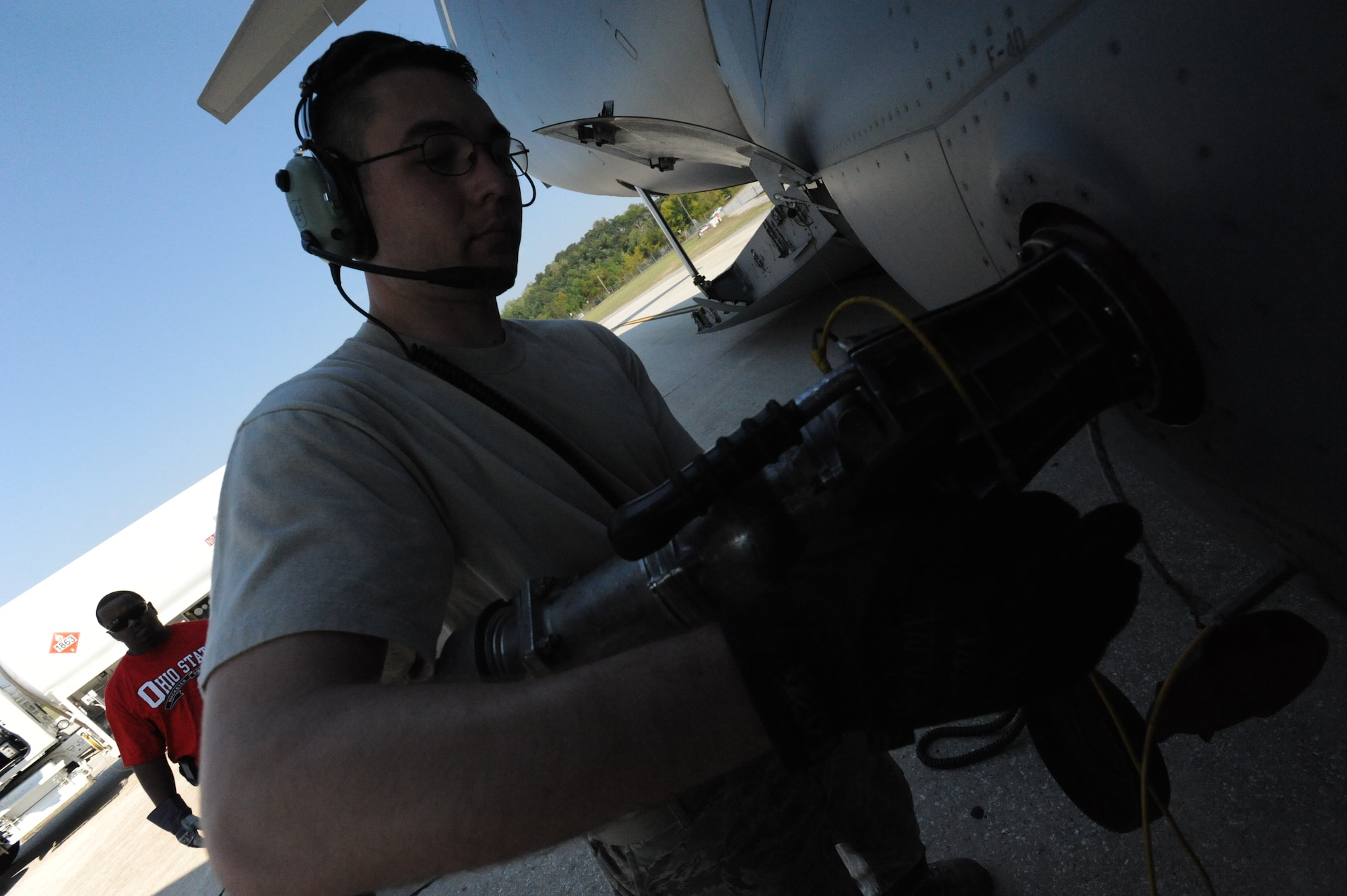 Staff Sgt. Josh Leugers, 15th Aircraft Maintenance Squadron flying crew chief, refuels a C-17 during a stop in Orlando, FL Oct. 10. A C-17 Globemaster III from the 15th Wing at Joint Base Pearl Harbor-Hickam made the long journey to Fort Benning to support the student jump requirements of the 507th Airborne School. (U.S. Air Force photo/Staff Sgt. Nathan Allen) 
