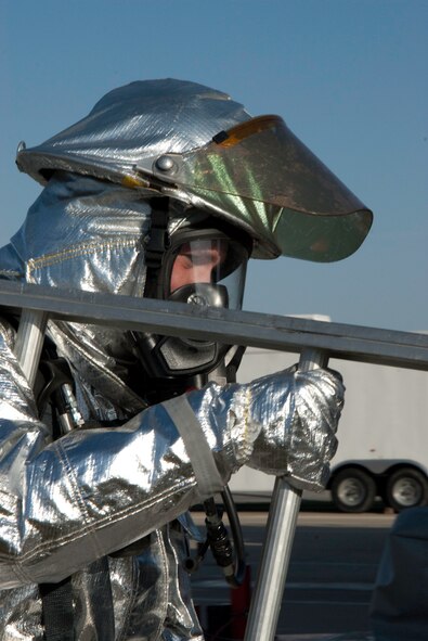 Members of the 139th Airlift Wing, Missouri Air National Guard, Civil Engineering, Fire Department, run through an obstacle coarse, October 17, 2010, at Rosecrans Memorial Airport in Saint Joseph MO. The firefighters perform the tasks as part of annual training. (U.S. Air Force photo by Senior Airman Sheldon Thompson/Released)