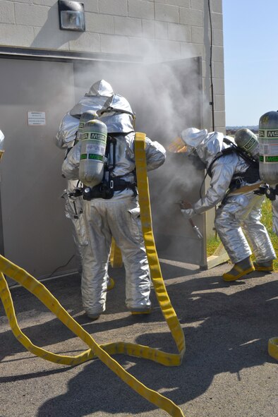 Firefighters of the 139th Airlift Wing, Missouri Air National Guard, participate in their Semi-Annual Munitions Area Response exercise Saturday, October 16, 2010 at Rosecrans Memorial Airport, St. Joseph, Mo.  This particular exercise covers explosives, munition classifications, firefighting tactics, overall safety and hazard procedures that they could possibly face.  (U.S. Air Force photo by Airman 1st Class Kelsey Stuart/Released)