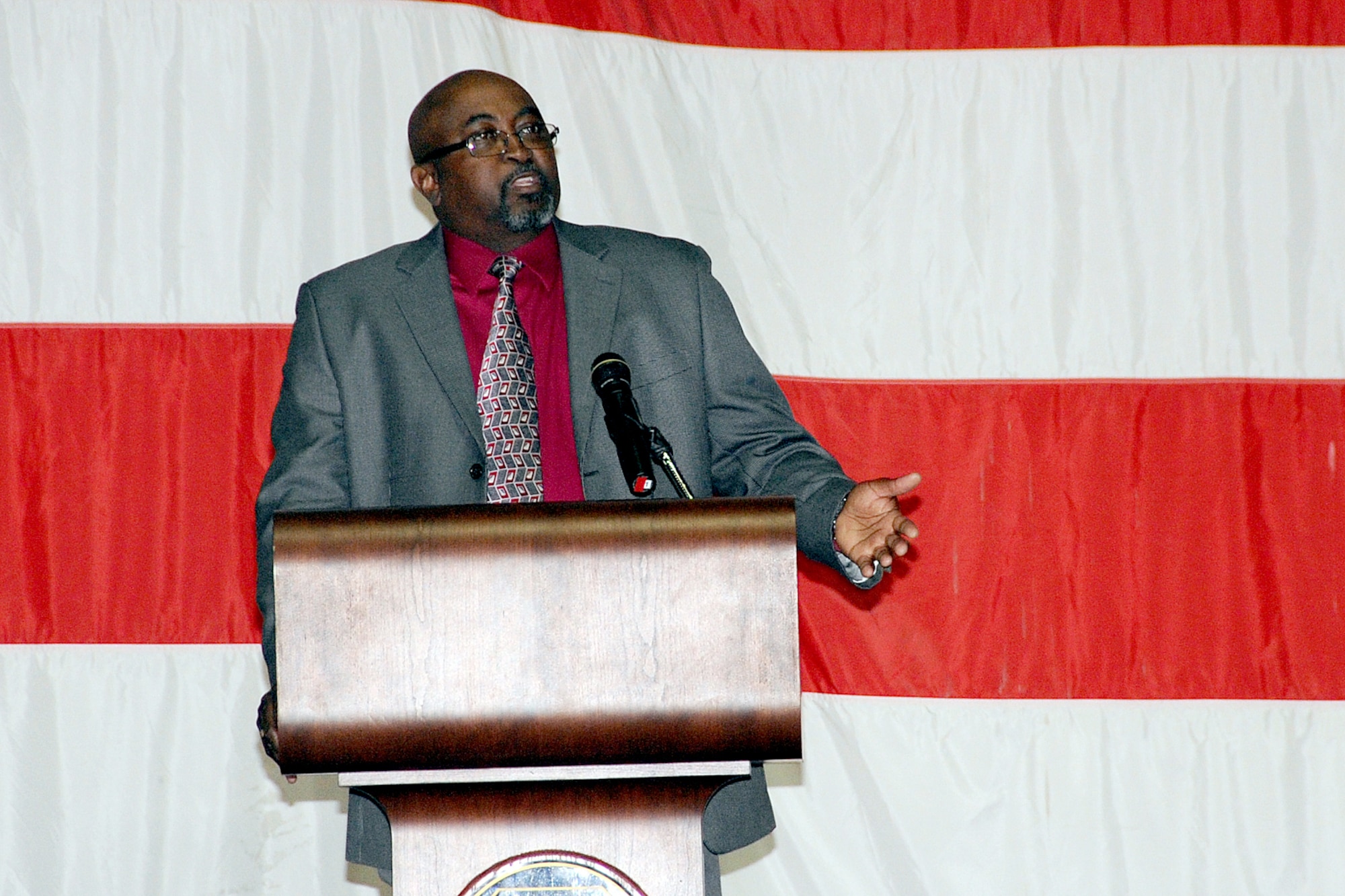 OFFUTT AIR FORCE BASE, Neb. - Grailand Williams, a representative of the Department of Veteran Affairs, speaks to retirees in attendance during Offutt's annual Retiree Appreciation Day Oct. 17. The event was held at the Offutt Field House and offered retirees from the local area the opportunity to attend briefings and receive information about a variety of agencies including the Retiree Activities Office, Airman & Family Readiness Center, Department of Veteran Affairs, Survivor Benefits, the Erhling Bergquist medical clinic and Legal office in addition to dental care and immunizations. U.S. Air Force photo by Kendra Williams