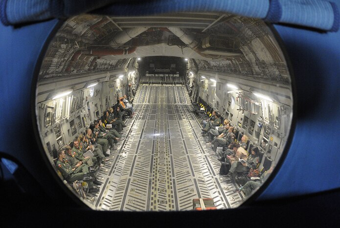 More than 60 spouses of military members were given the opportunity to take a orientation flight to learn what their spouse?s job entails during a routine training mission onboard a Charleston C-17, Oct. 16. The orientation flight is a way to familiarize spouses with their Airman?s job and showcase the unit?s mission. (U.S. Navy photo/Mass Communication Specialist 1st Class Jennifer Hudson)