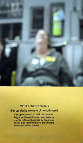 During a spouse orientation flight, Oct. 16 on a Charleston C-17 from Joint Base Charleston-Air Base to the North training fields, some members had to be given a motion sickness bags due to the turbulence and the roller-coaster feel from the aircraft. (U.S. Navy photo/Mass Communication Specialist 1st Class Jennifer Hudson)