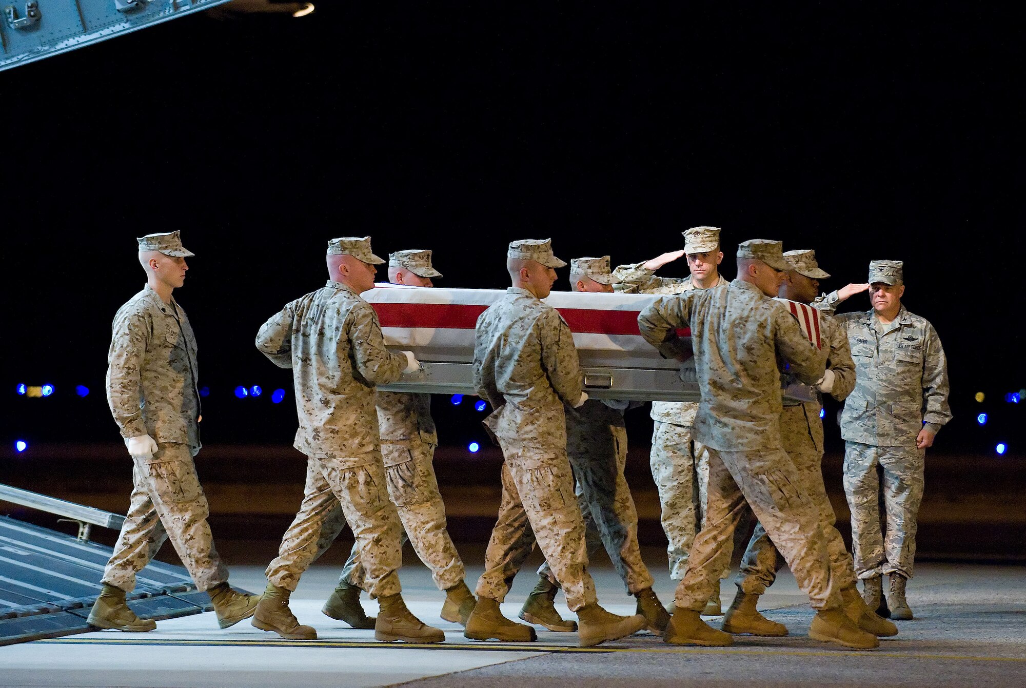 A U.S. Marine Corps carry team transfers the remains of Marine Cpl. Jorge Villarreal Jr. of San Antonio, Texas, at Dover Air Force Base, Del., Oct. 18, 2010.  He was assigned to 1st Battalion, 11th Marine Regiment, 1st Marine Division, I Marine Expeditionary Force, Camp Pendleton, Calif. (U.S. Air  Force photo/Jason Minto)