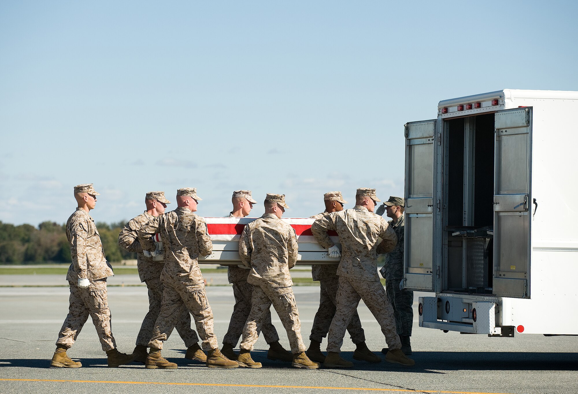 A U.S. Marine Corps carry team transfers the remains of Marine Lance Cpl. Irvin Ceniceros of Clarksville, Ark., at Dover Air Force Base, Del., Oct. 16, 2010. Ceniceros was assigned to 3rd Battalion, 5th Marine Regiment, 1st Marine Division, I Marine Expeditionary Force, Camp Pendleton, Calif.  (U.S. Air Force photo/Jason Minto)