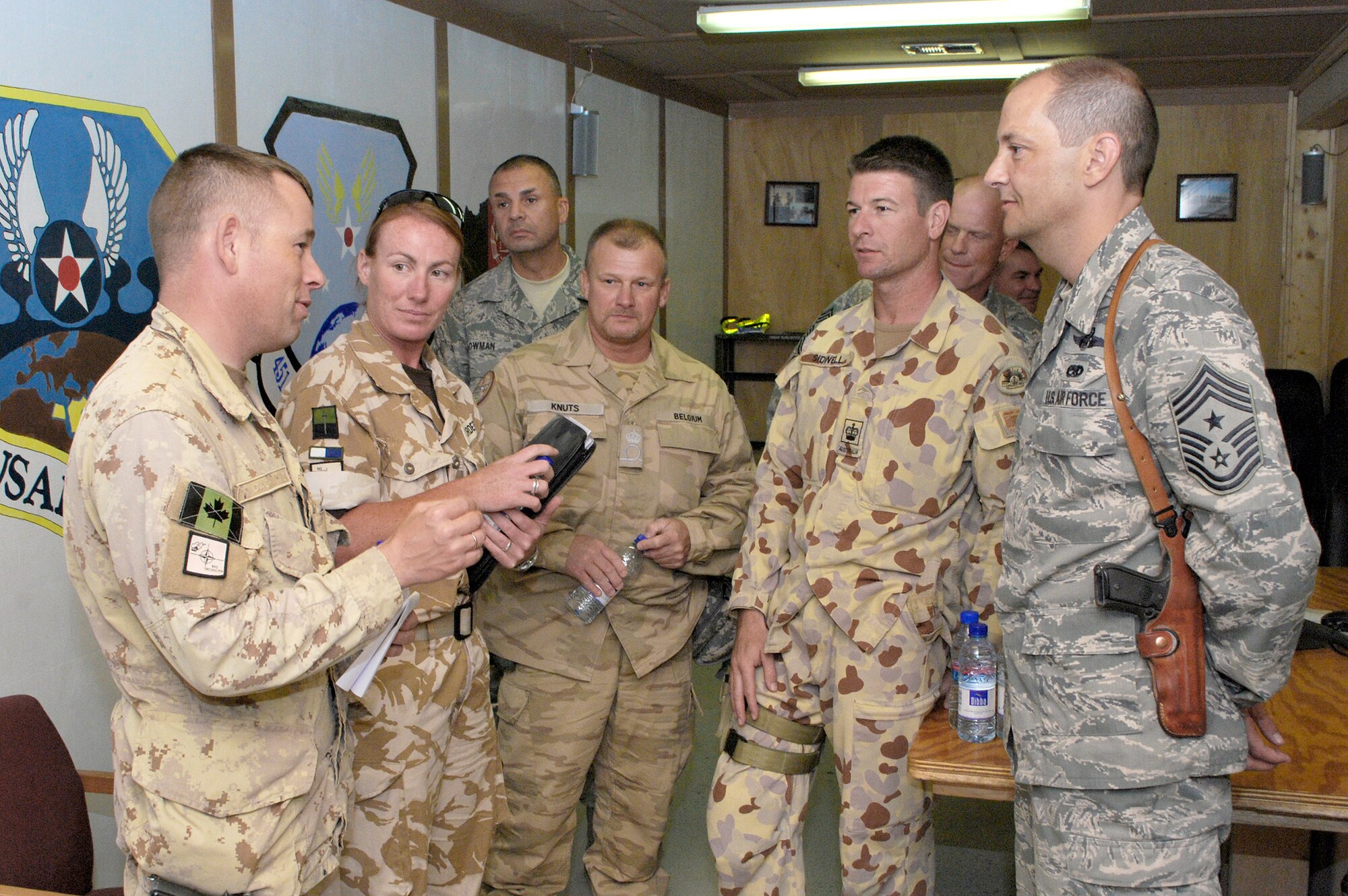 NATO partner military members and Airmen mingle after a senior NCO panel discussion Oct. 13, 2010, at Kandahar Airfield, Afghanistan. The Air Force SNCOs hosted the NATO members to increase awareness of other nations' military standards, customs and courtesies and traditions. (U.S. Air Force photo/Senior Airman Melissa B. White)