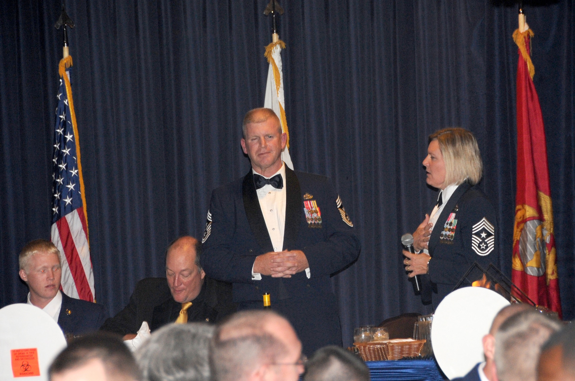 OFFUTT AIR FORCE BASE, Neb. - Chief Master Sgt.Suzan Sangster, 55th Wing command chief, speaks to Chief Master Sgt. Harold Clark, 12th Air Force command chief and guest speaker, at Offutt's annual Enlisted Dining Out at the Patriot Club Oct. 15. The primary purpose of a dining-out is to bring military members together in an atmosphere of camaraderie, fellowship and social rapport. The goal is to have a good time and enjoy the company of fellow Airmen. U.S. Air Force photo by Kendra Williams