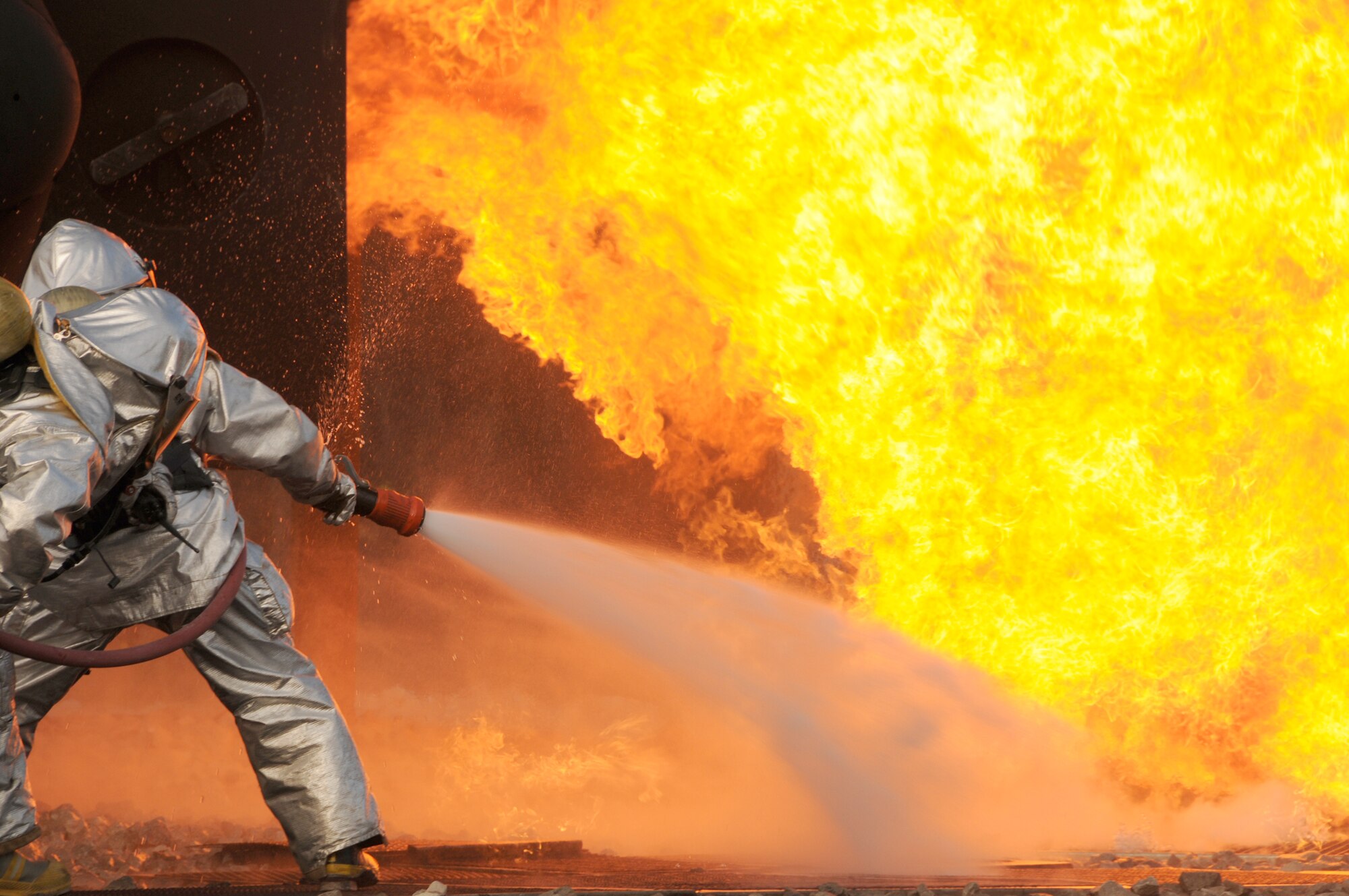 Firefighters from the Ohio Air National Guard's 180th Fighter Wing extinguish an aircraft fire during a training exercise Oct. 16, 2010, at the Phelps Collins Combat Readiness Training Center in Alpena, Mich. (U.S. Air Force photo/Senior Airman Amber Williams)