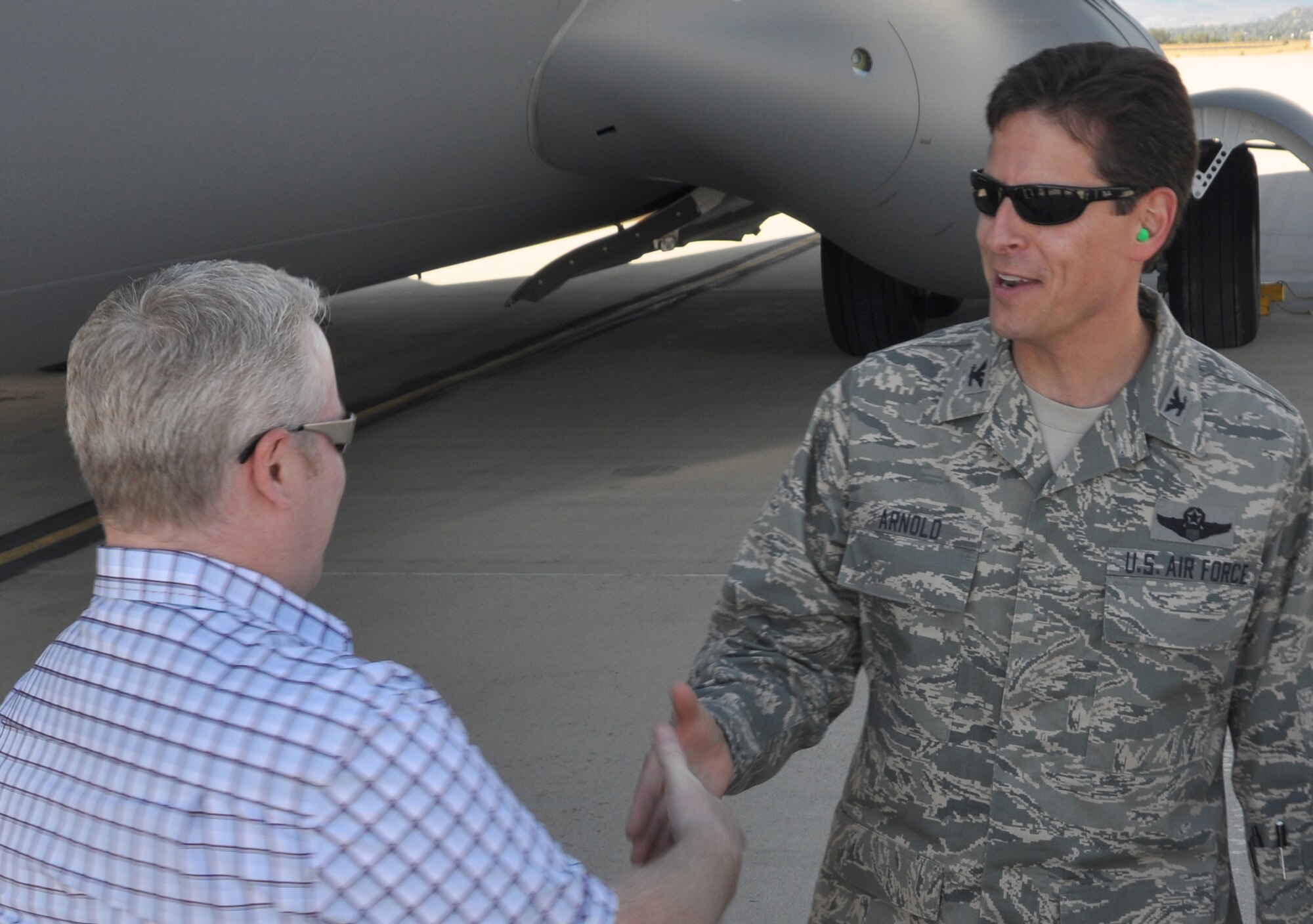 Col. Courtney Arnold (right), 302nd Airlift Wing vice commander, greets Paul Chabot, Jr., after his arrival Oct. 14 to Peterson Air Force Base, Colo. Mr. Chabot was one of 24 civic leaders from the Yuba County, Calif., area taking part in a joint 940th Wing/9th Reconnaissance Wing Community Relations Tour to the Colorado Springs area. From Oct. 14-15, the civic leaders were briefed on several missions, including the Air Force Reserve's 302nd Airlift Wing tactical airlift and airdrop and Modular Airborne Firefighting System aerial firefighting missions. The civic leaders also visited U.S. Northern Command, Air Force Space Command and the U.S. Air Force Academy. Air Force-sponsored Community Relations Tours allow community and civic leaders to gain a better perspective on how the Air Force Reserve and its Active Duty counterparts work together. (U.S. Air Force photo/Staff Sgt. Stephen J. Collier)