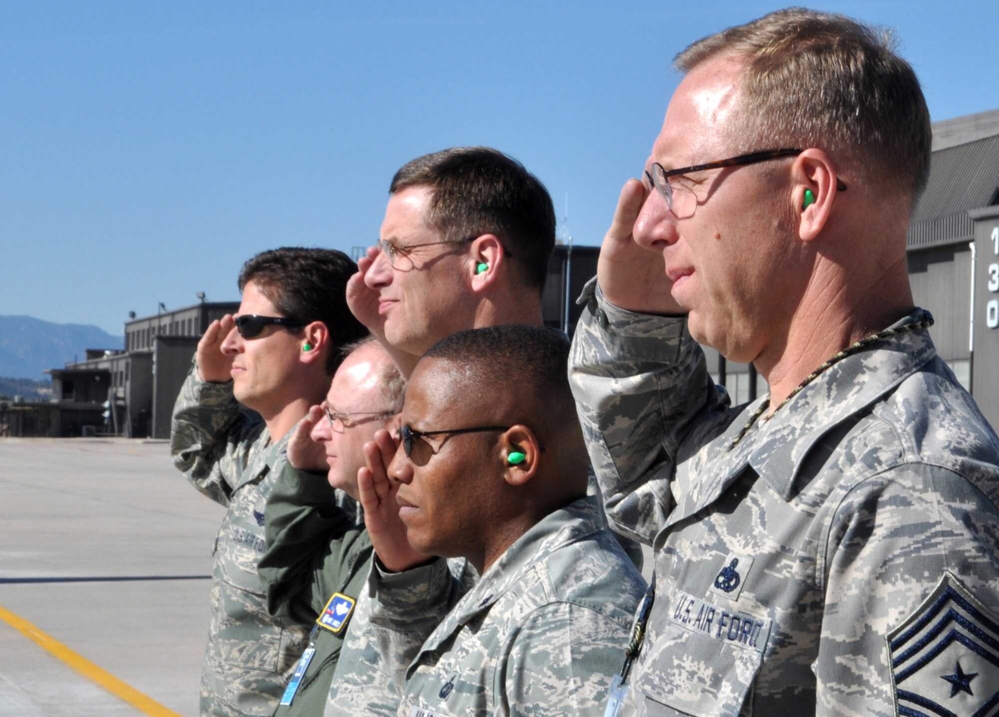 Chief Master Sgt. Joseph Westerlund (foreground) and an official party from the 302nd Airlift Wing and 21st Space Wing welcome civic leaders from Beale Air Force Base, Calif., Oct. 14 during a joint 940th Wing/9th Reconnaissance Wing Community Relations Tour to Peterson Air Force Base, Colo. From Oct. 14-15, the civic leaders, who are residents throughout Yuba County, Calif., were briefed on several missions, including the Air Force Reserve's 302nd Airlift Wing tactical airlift and airdrop and Modular Airborne Firefighting System aerial firefighting missions.  The civic leaders also visited U.S. Northern Command, Air Force Space Command and the U.S. Air Force Academy. Air Force-sponsored Community Relations Tours allow community and civic leaders to gain a better perspective on how the Air Force Reserve and its Active Duty counterparts work together. Chief Westerlund is the 302nd AW command chief. (U.S. Air Force photo/Staff Sgt. Stephen J. Collier)