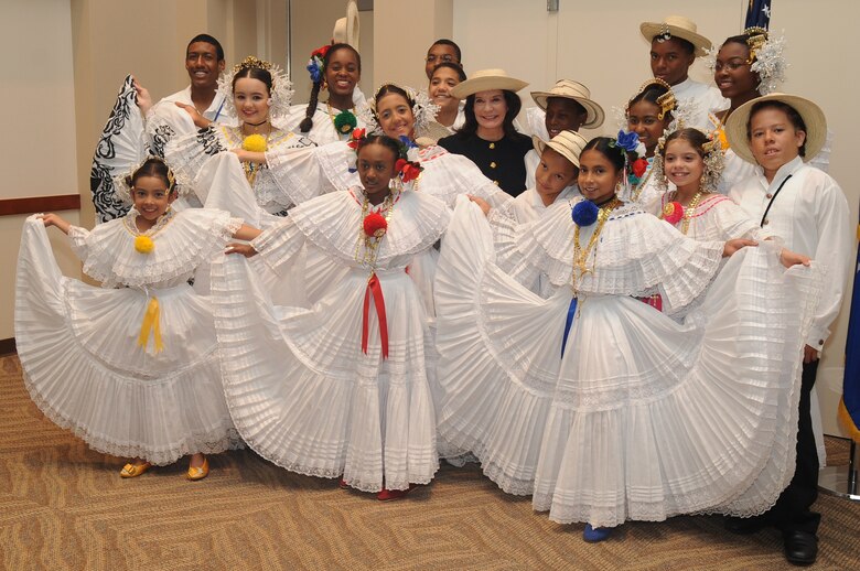 BUCKLEY AIR FORCE BASE, Colo. -- Linda Alvarado poses for a picture with the dance group Flokloricas Panamericans at the Hispanic Heritage Month observance on Oct. 15. The group traveled from Colorado Springs to perform and Mrs. Linda Alvarado was the guest speaker at the event. (U.S. Air Force Photo by Airman Manisha Vasquez) 