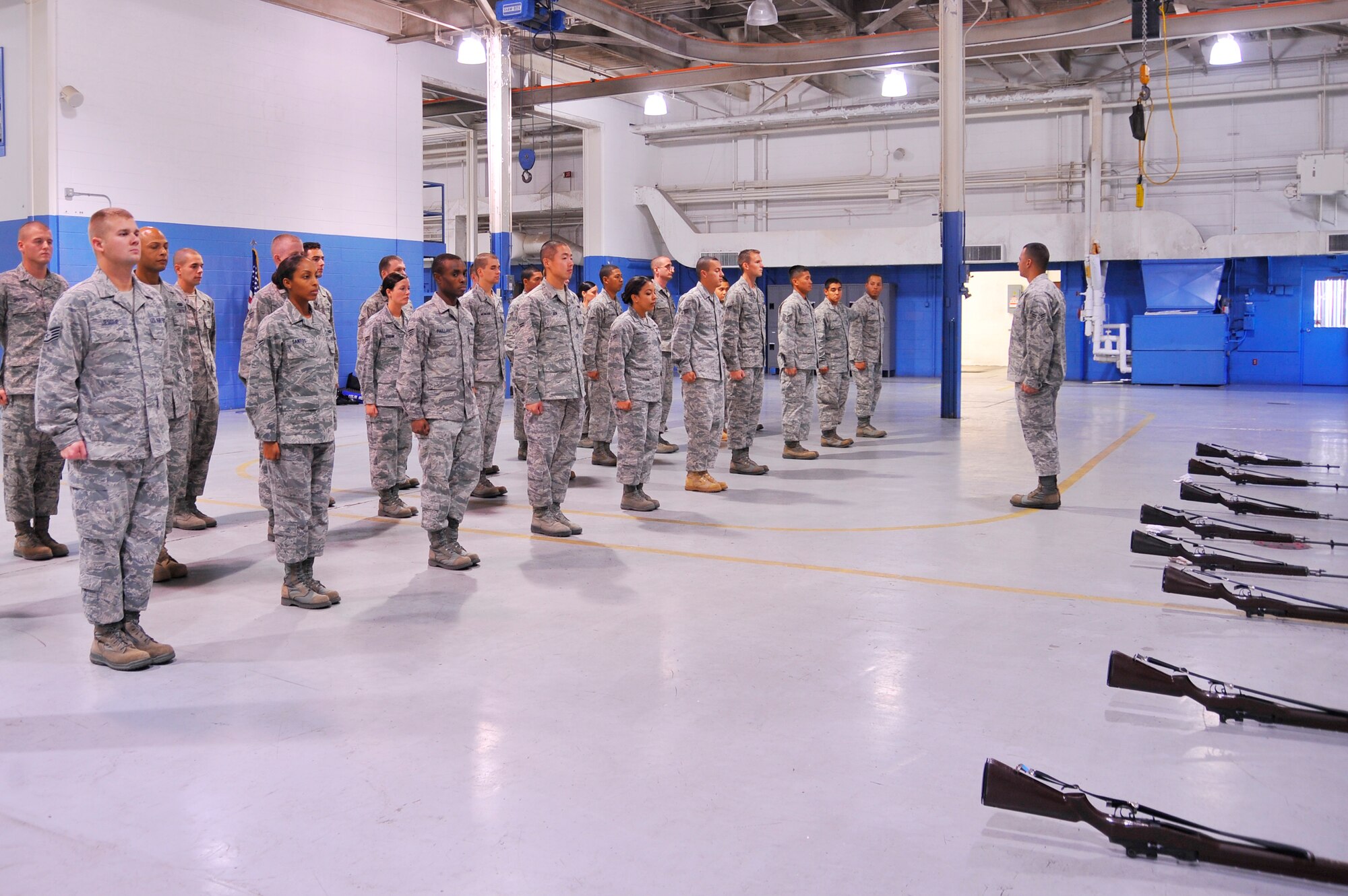 Airman 1st Class Justin Baker, Mobile Training Team superintendent, forms up Hurlburt Field and Eglin Honor Guard Airmen to perform exercises during the MTT course. This training was part of a two-week course to standardize Honor Guard sequences Air Force-wide. (DoD photo by Air Force Senior Airman Sheila DeVera, released)