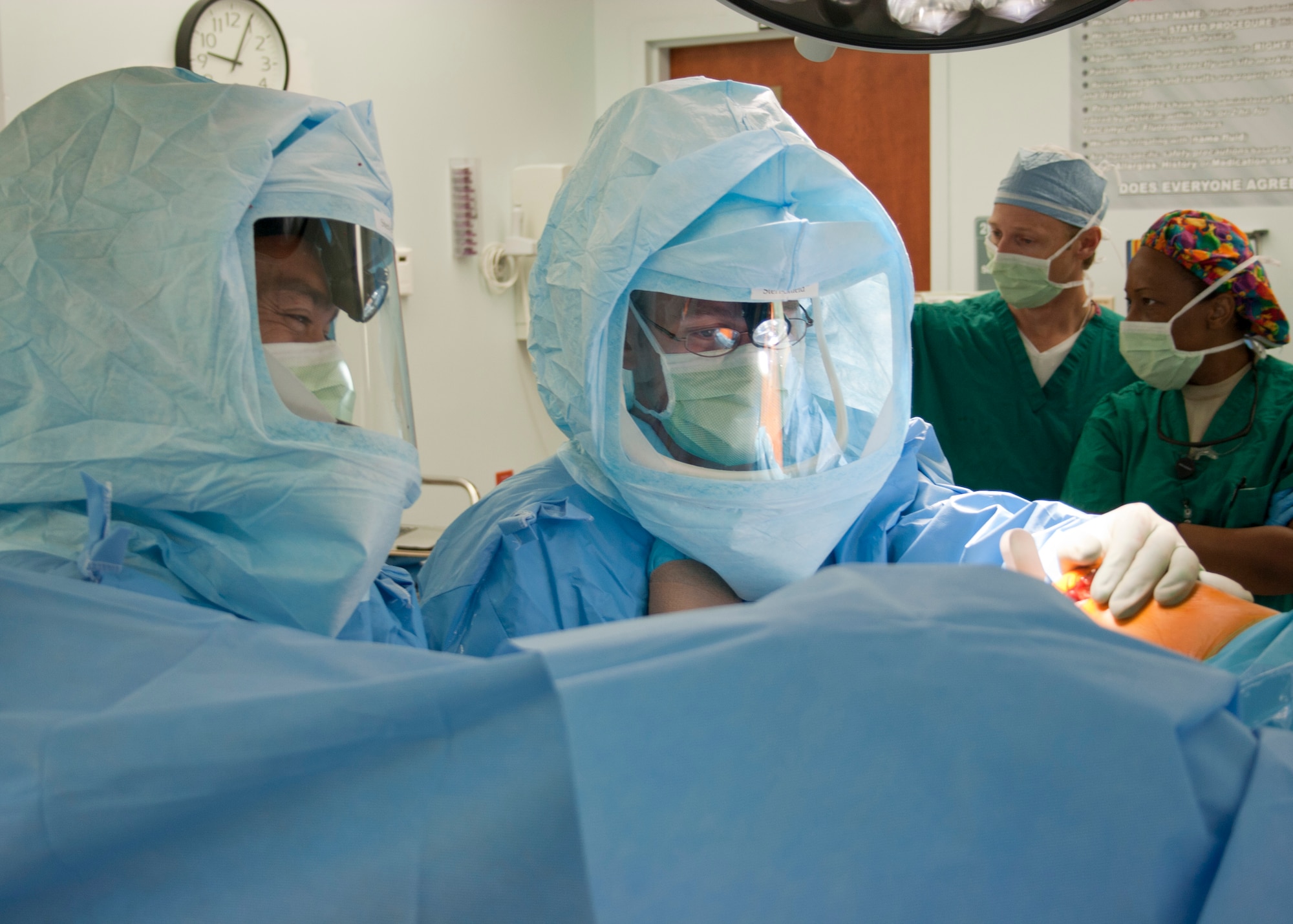 EGLIN AIR FORCE BASE, Fla. - Lt. Col. Bradley Goeke and Lt. Col. Anthony Brothers, 96th Medical Group, test knee movement after attaching trial joint hardware during a partial knee replacement surgery. Eglin doctors perform surgeries like these to prepare to treat wounded military members. (U.S. Air Force photo/2nd Lt. Andrew Caulk)